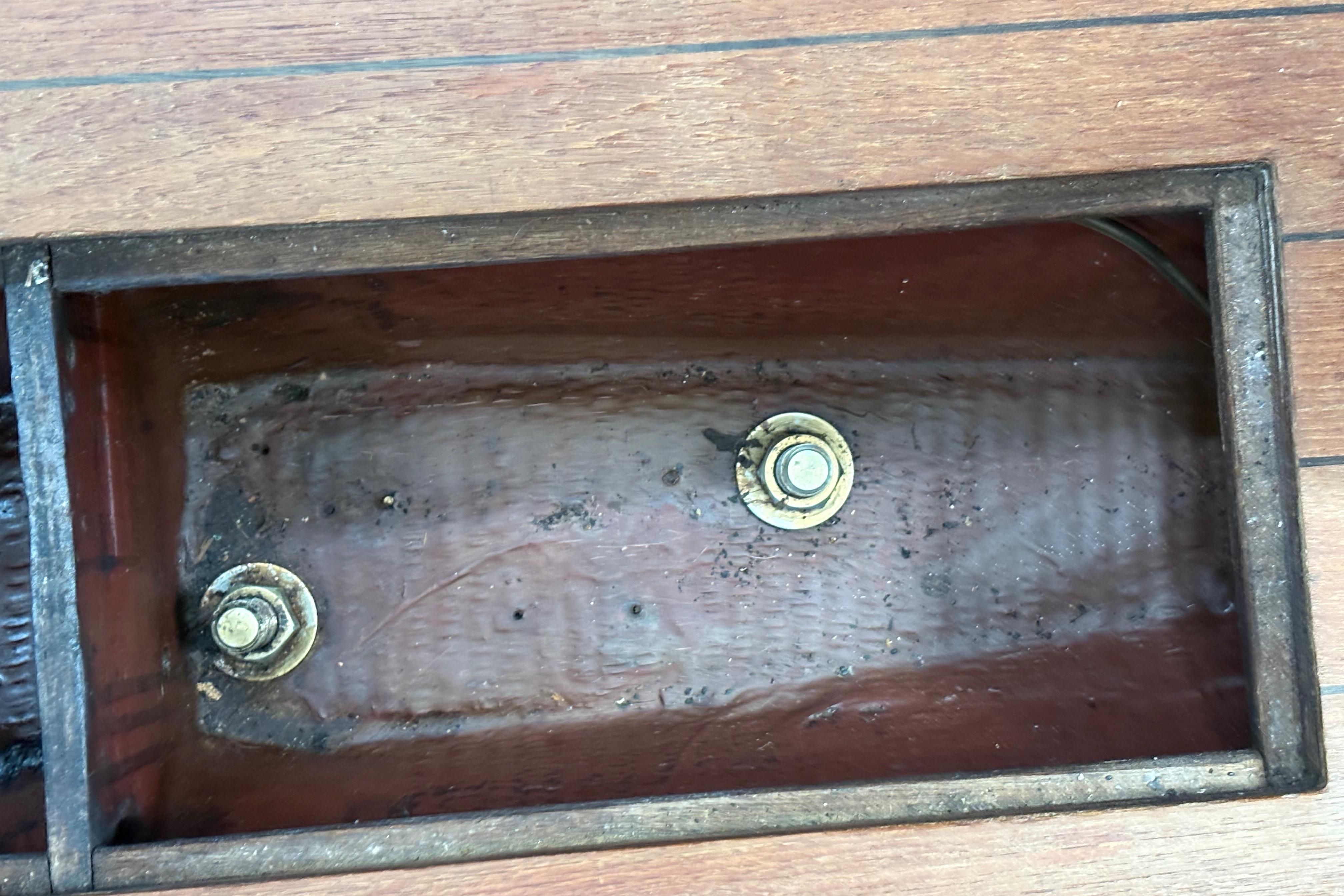 Wooden compartment with bolts, Sabre 31 sailboat, 1981 model.