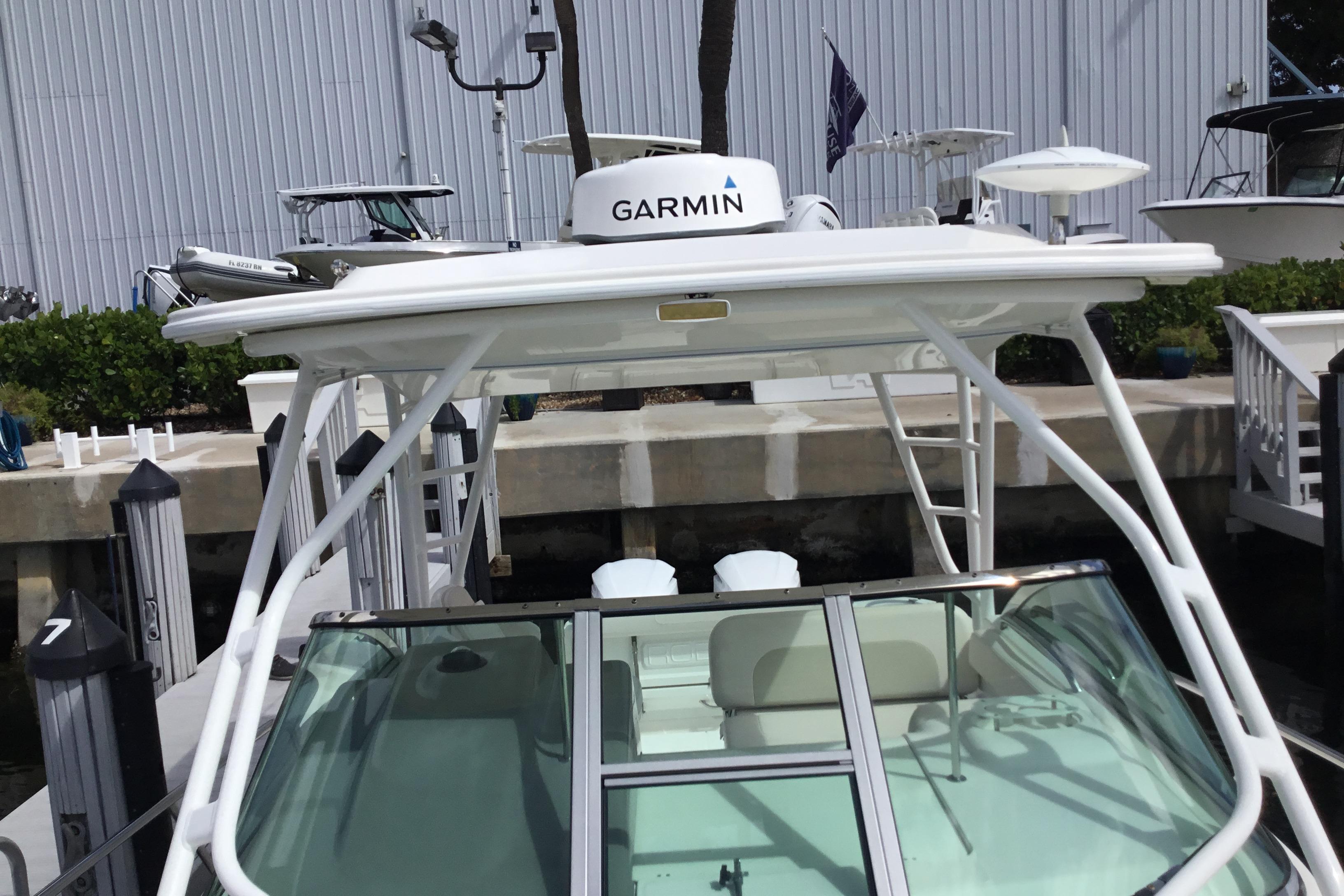 2017 Robalo R305 Walkaround boat with Garmin equipment at dockside.