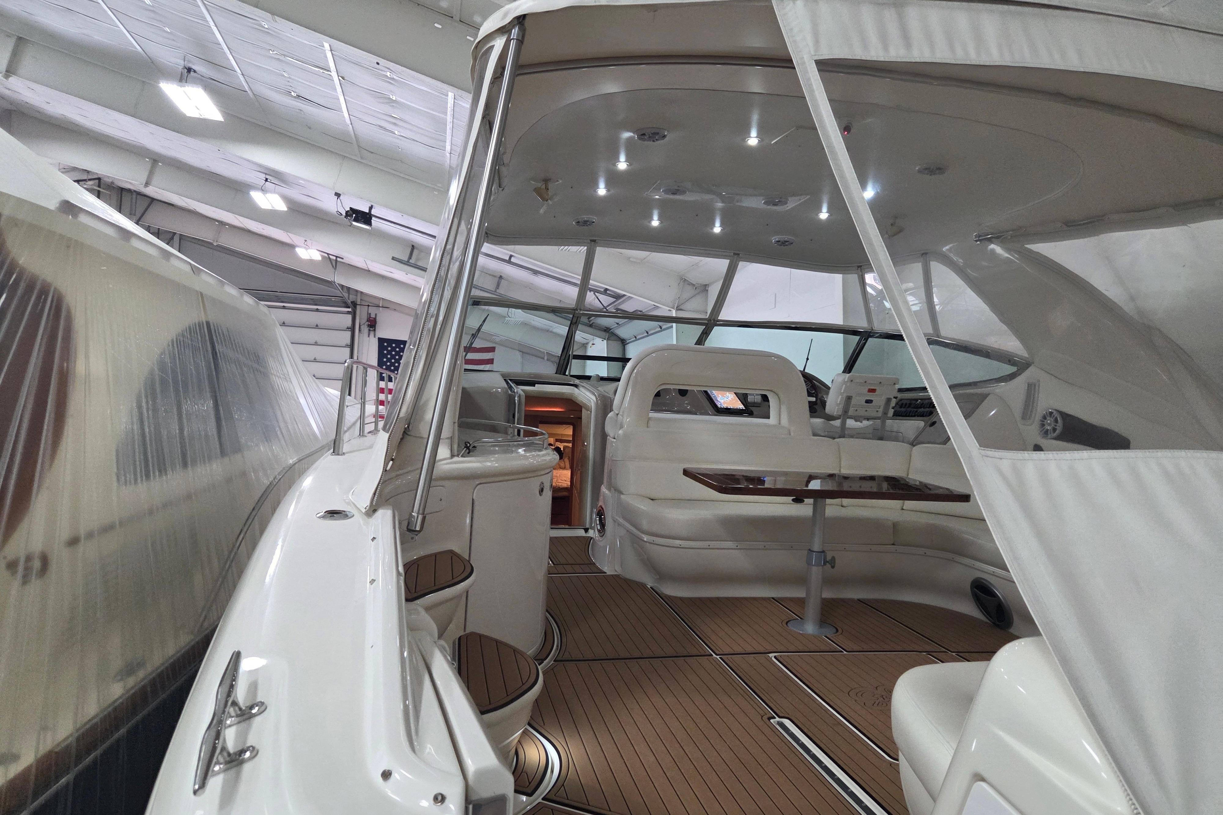 Luxurious 2000 Sea Ray Sundancer 540 yacht interior with elegant seating and wooden flooring.