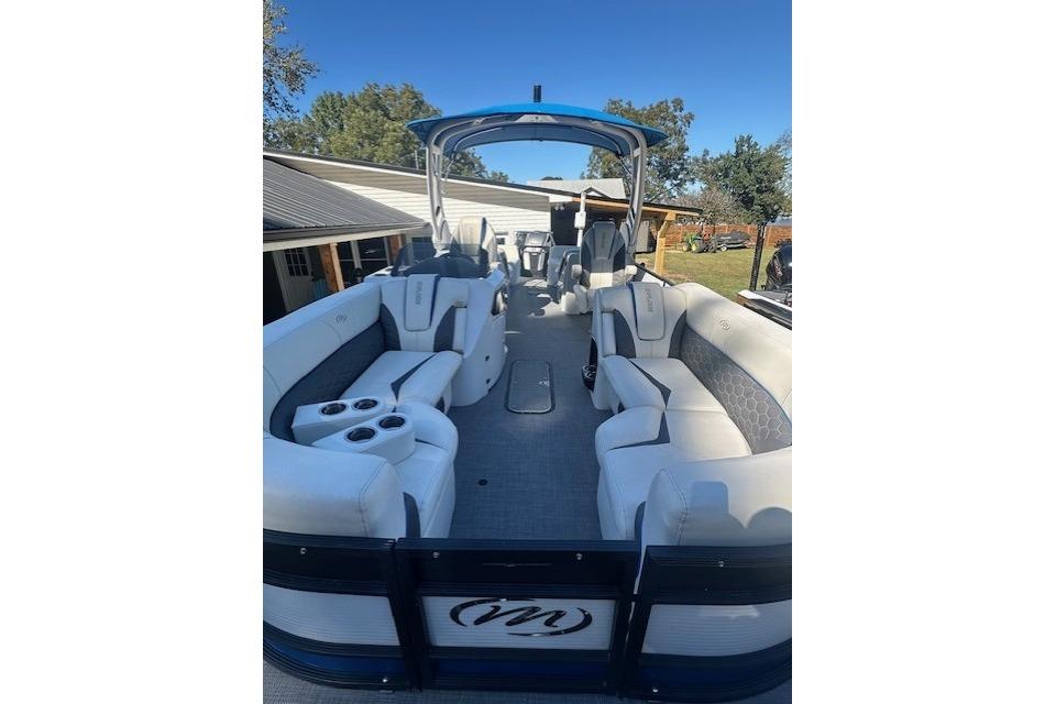 2020 Manitou 25 X-Plode RFW pontoon boat with spacious seating and modern design.