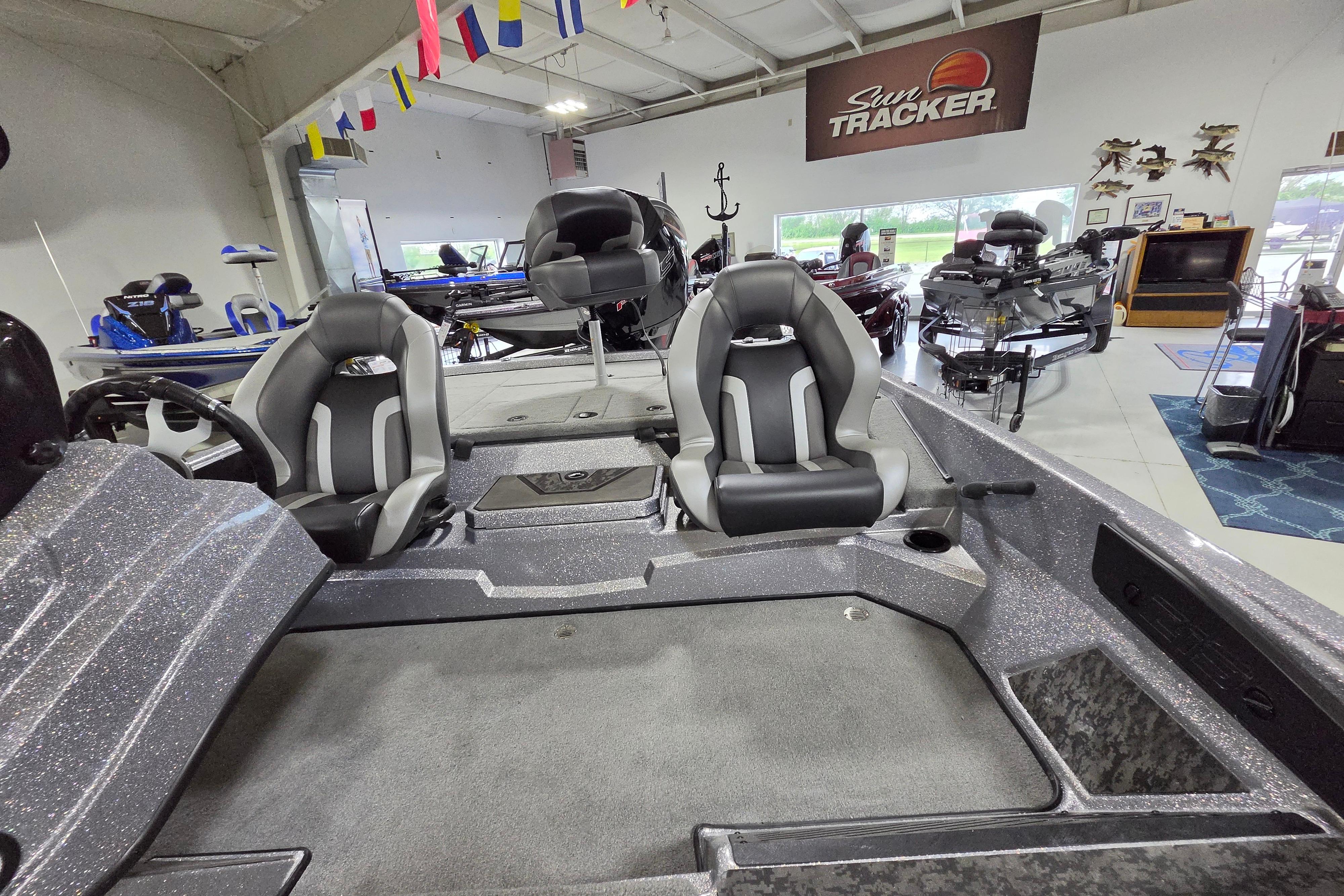 2026 Nitro Z19 XL boat interior with dual seats in a showroom.