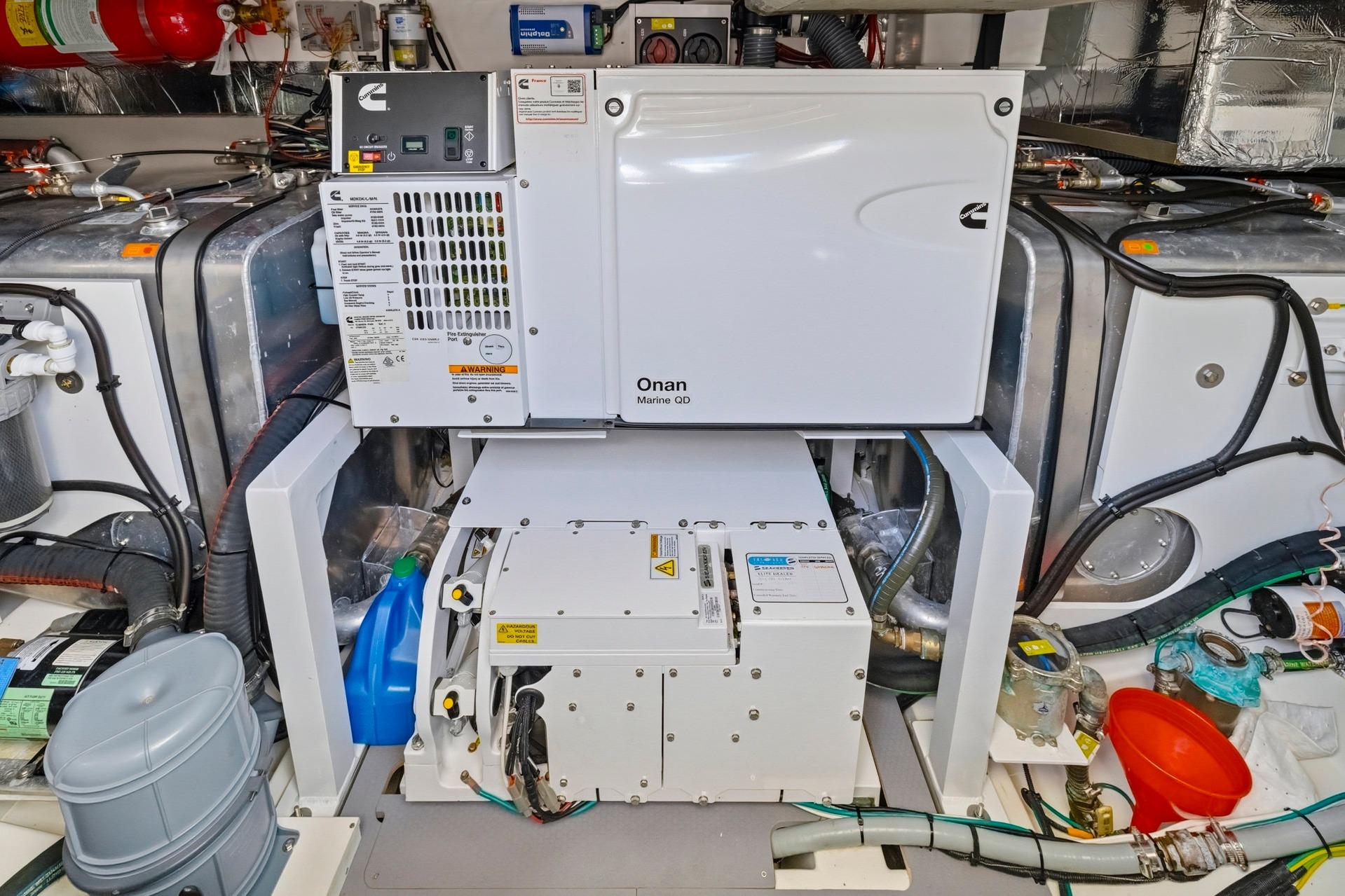 Engine room of a 2022 Prestige 520 yacht with Onan Marine generator.