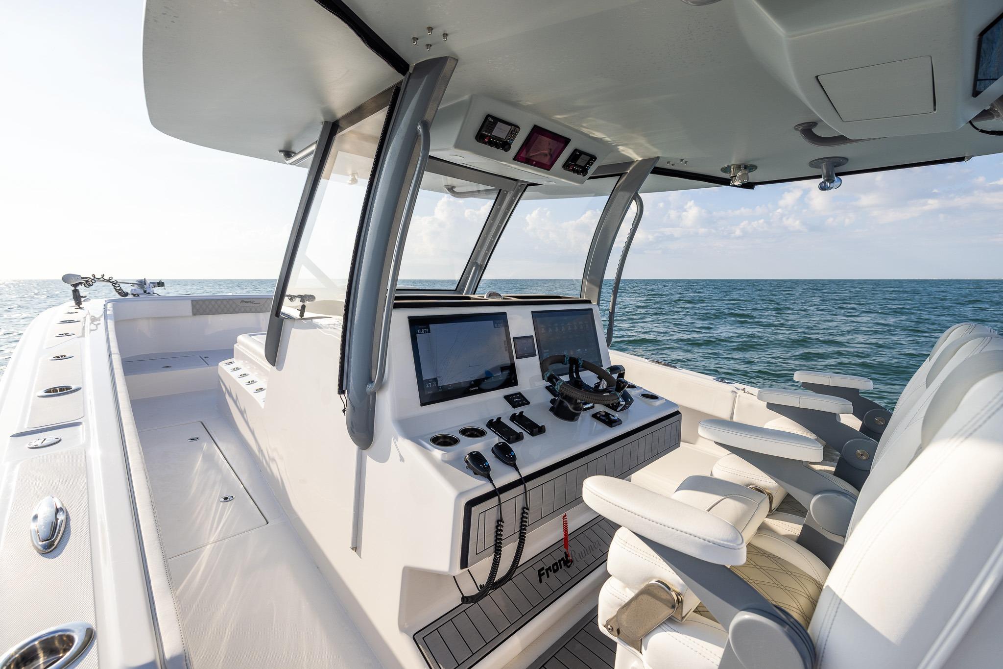 Interior view of 2026 Front Runner 37 Catamaran, featuring modern helm and ocean backdrop.