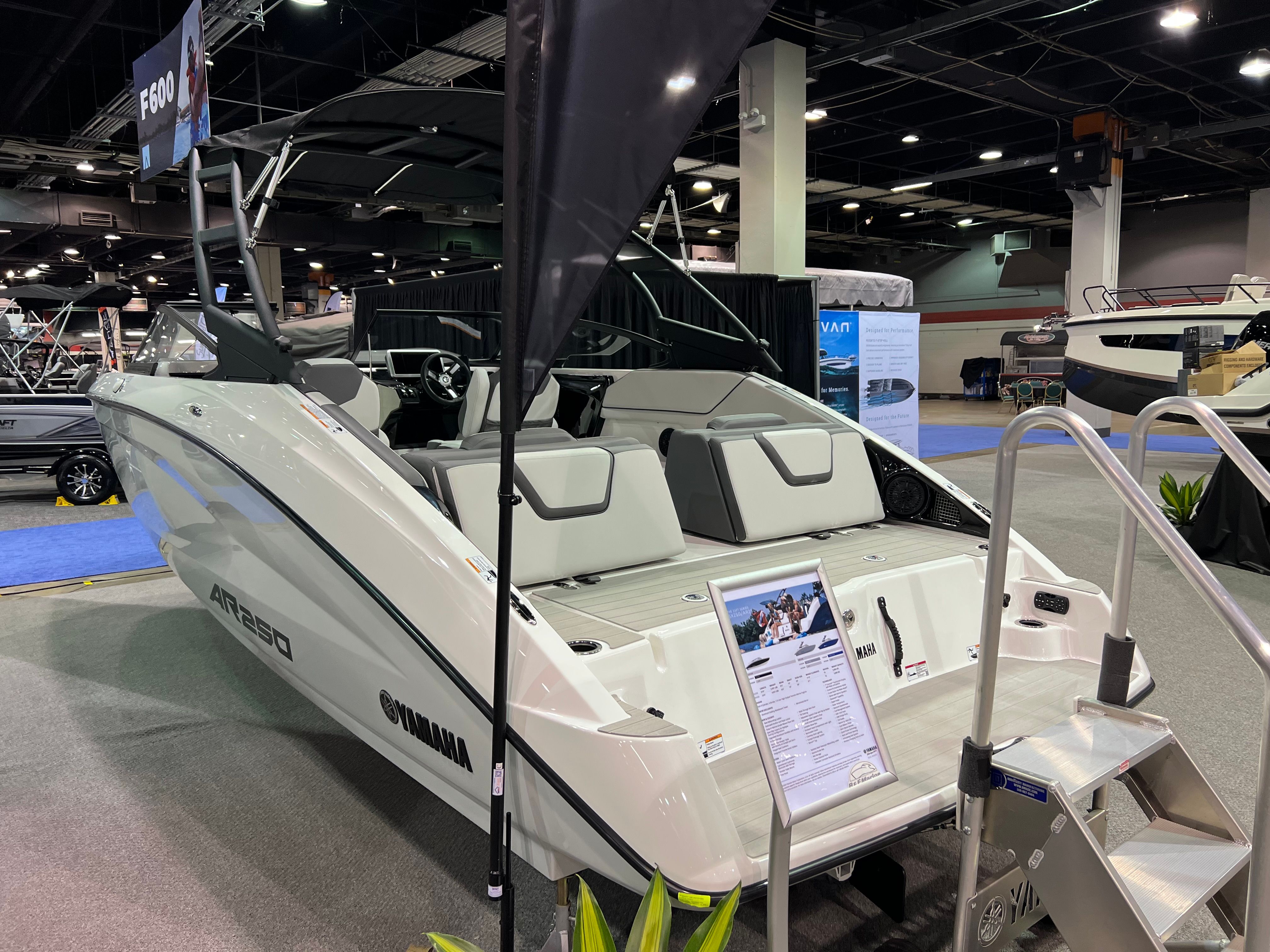 Yamaha AR250 2025 boat displayed at a trade show.