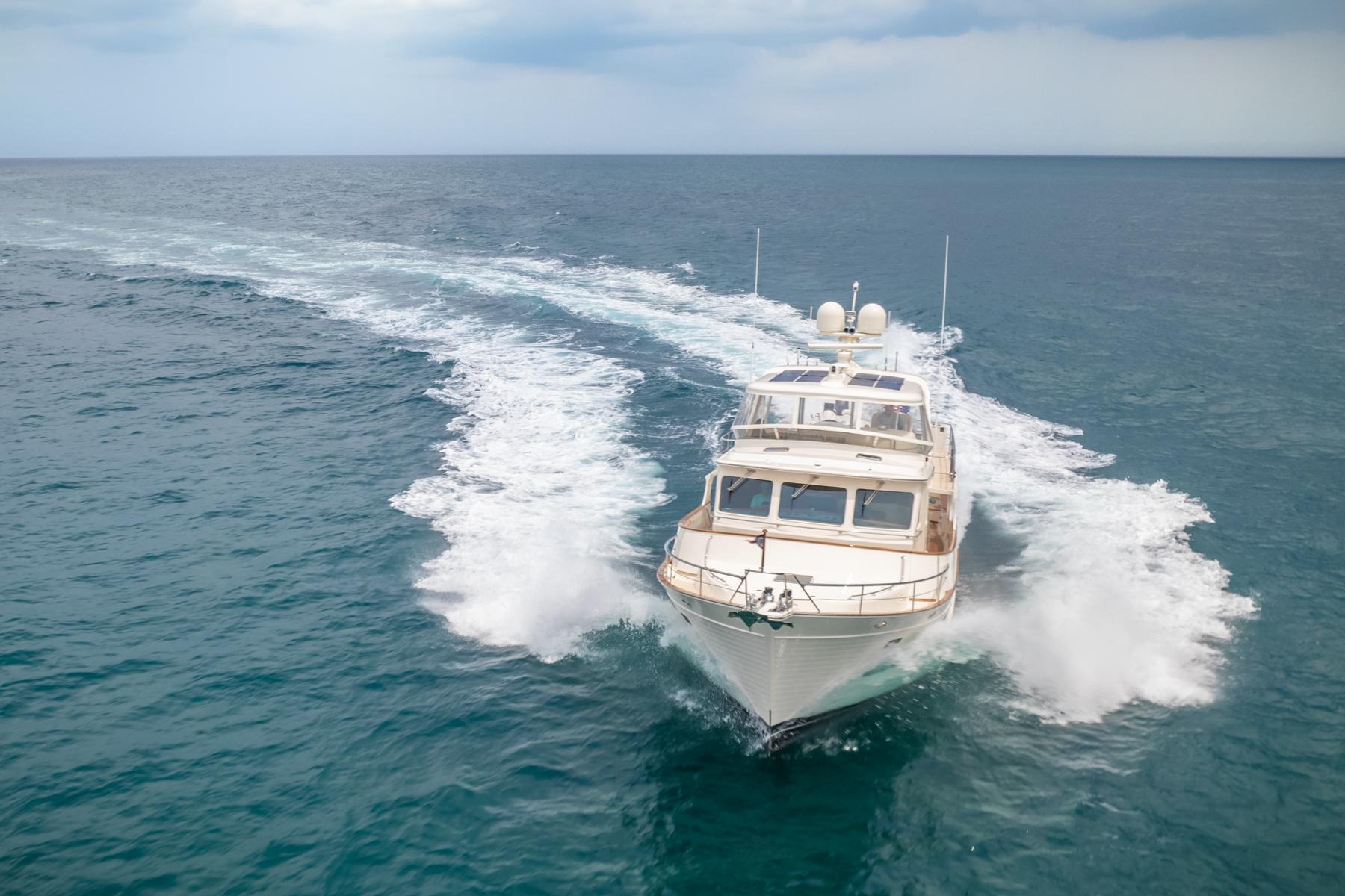 Luxury Fleming 65 yacht cruising on open sea, 2027 model.