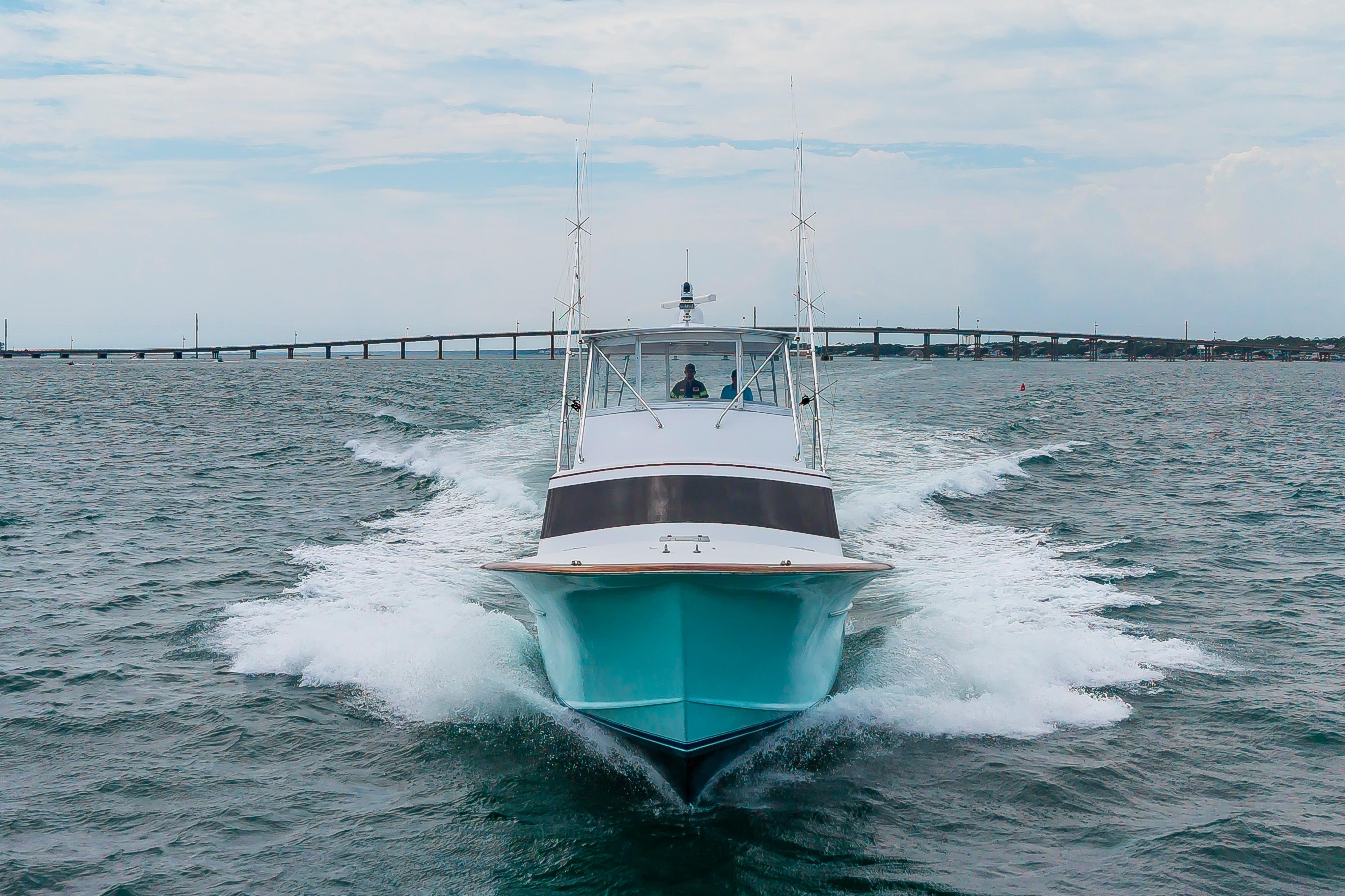 Custom Carolina Scarborough 56 Convertible yacht cruising on open water, 1993 model.