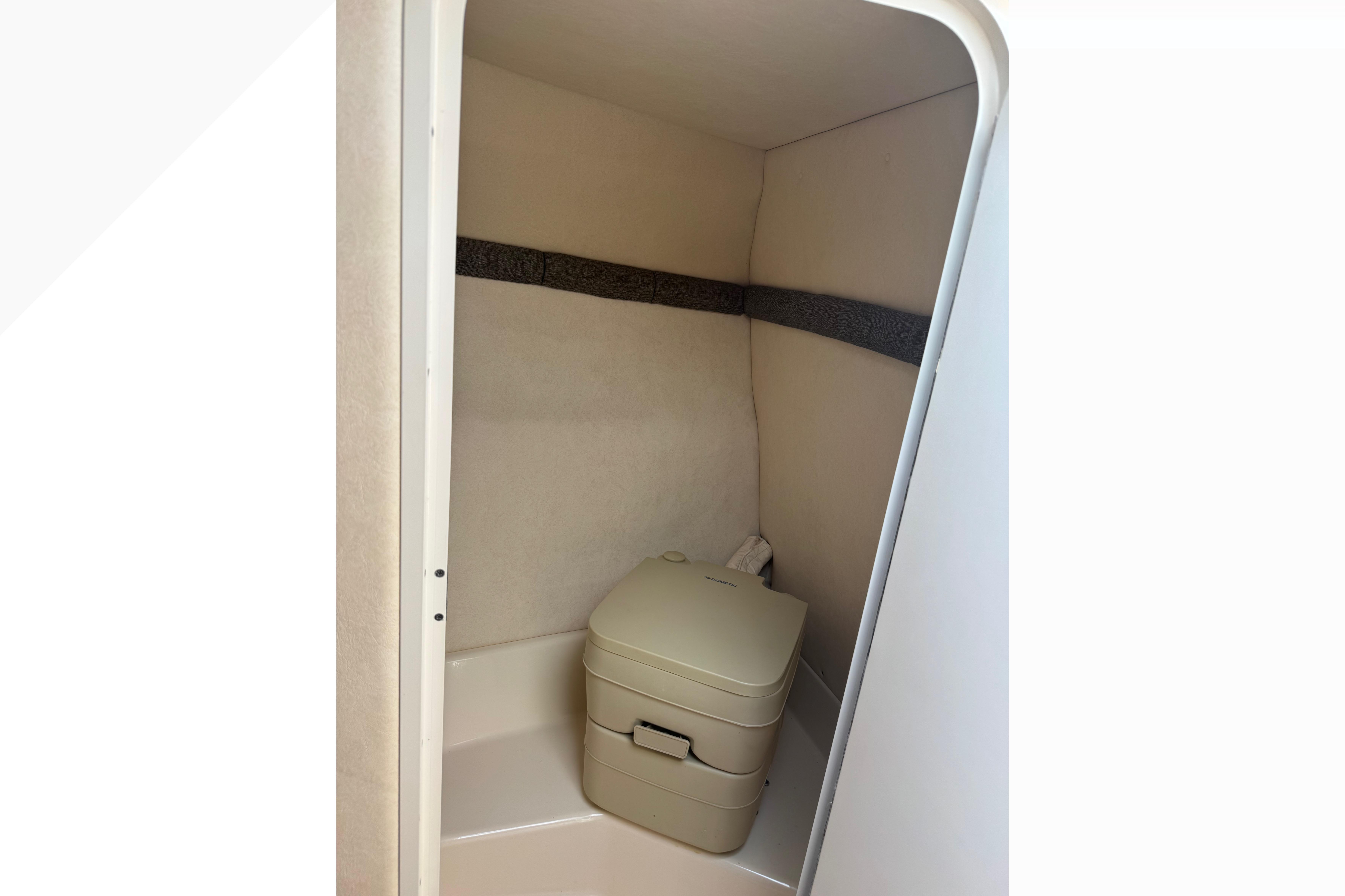 2001 Sea Ray 245 Weekender cabin with compact portable toilet.