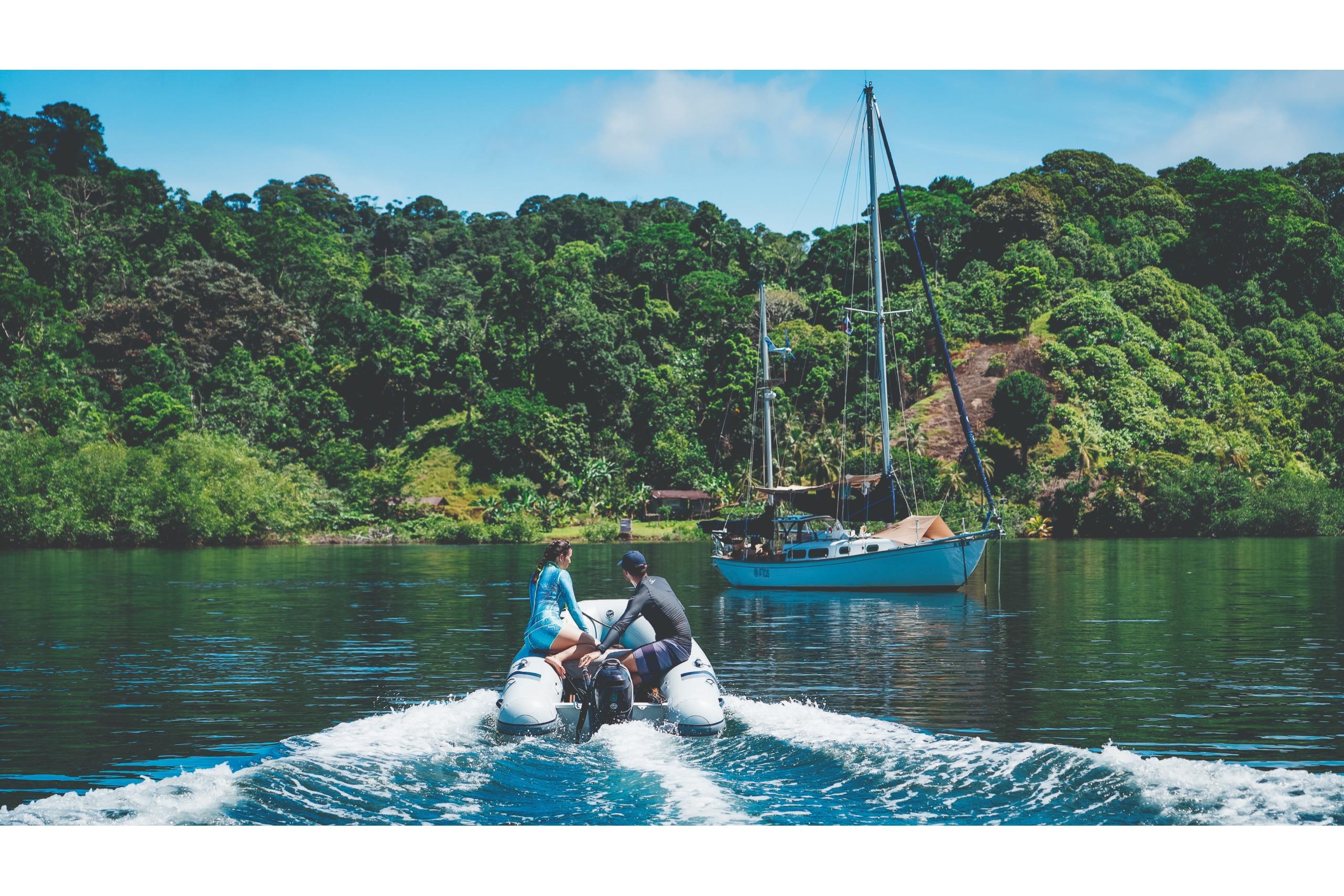 Highfield UltraLite 290LT 2024 on a serene lake with lush forest.