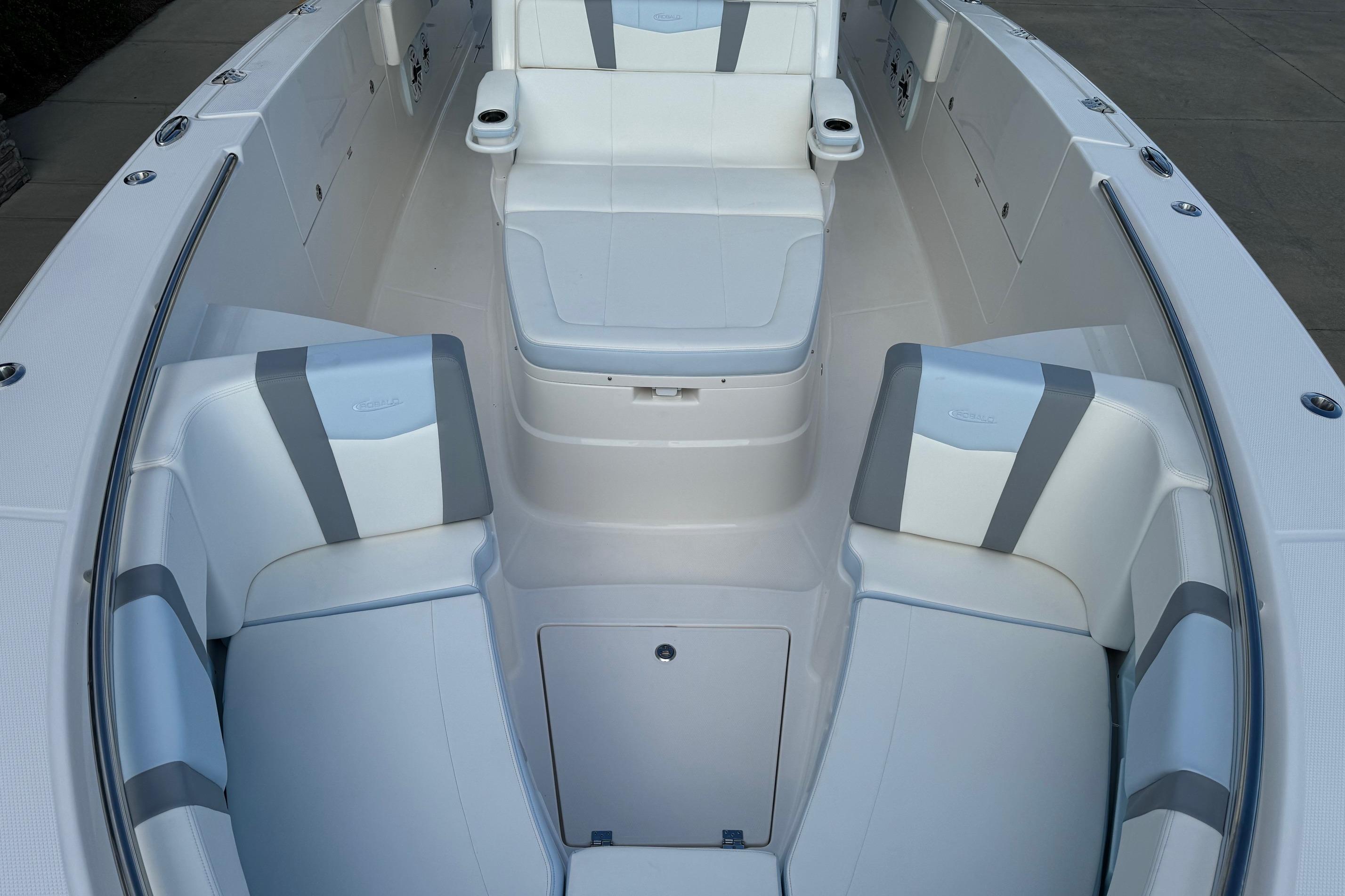 2025 Robalo R360 Center Console boat interior with white and gray seating.