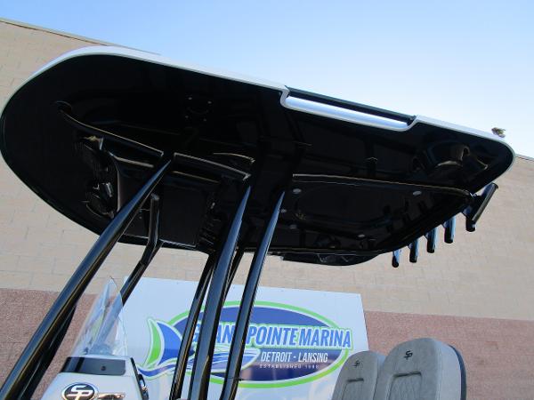 2025 Sea Pro 230 Bay boat T-top at marina, showcasing sleek design and sturdy construction.
