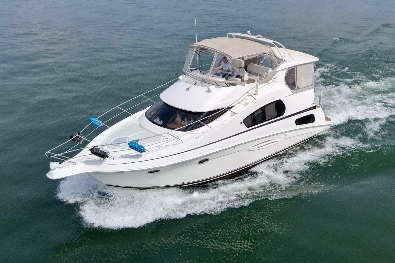 2004 Silverton 39 Motor Yacht cruising on open water.