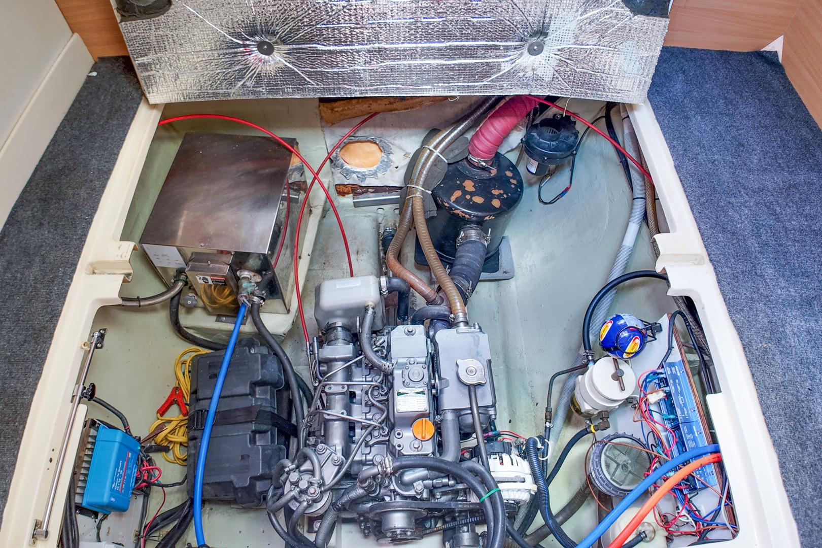Engine compartment of a 2005 Leopard 43 yacht, showcasing mechanical components and wiring.