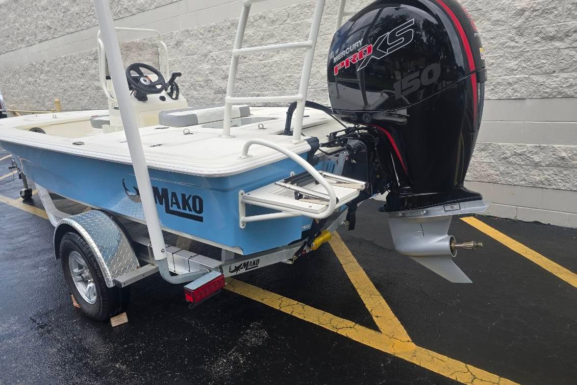 2026 Mako 18 Pro Skiff boat with Mercury Pro XS 150 engine on trailer.