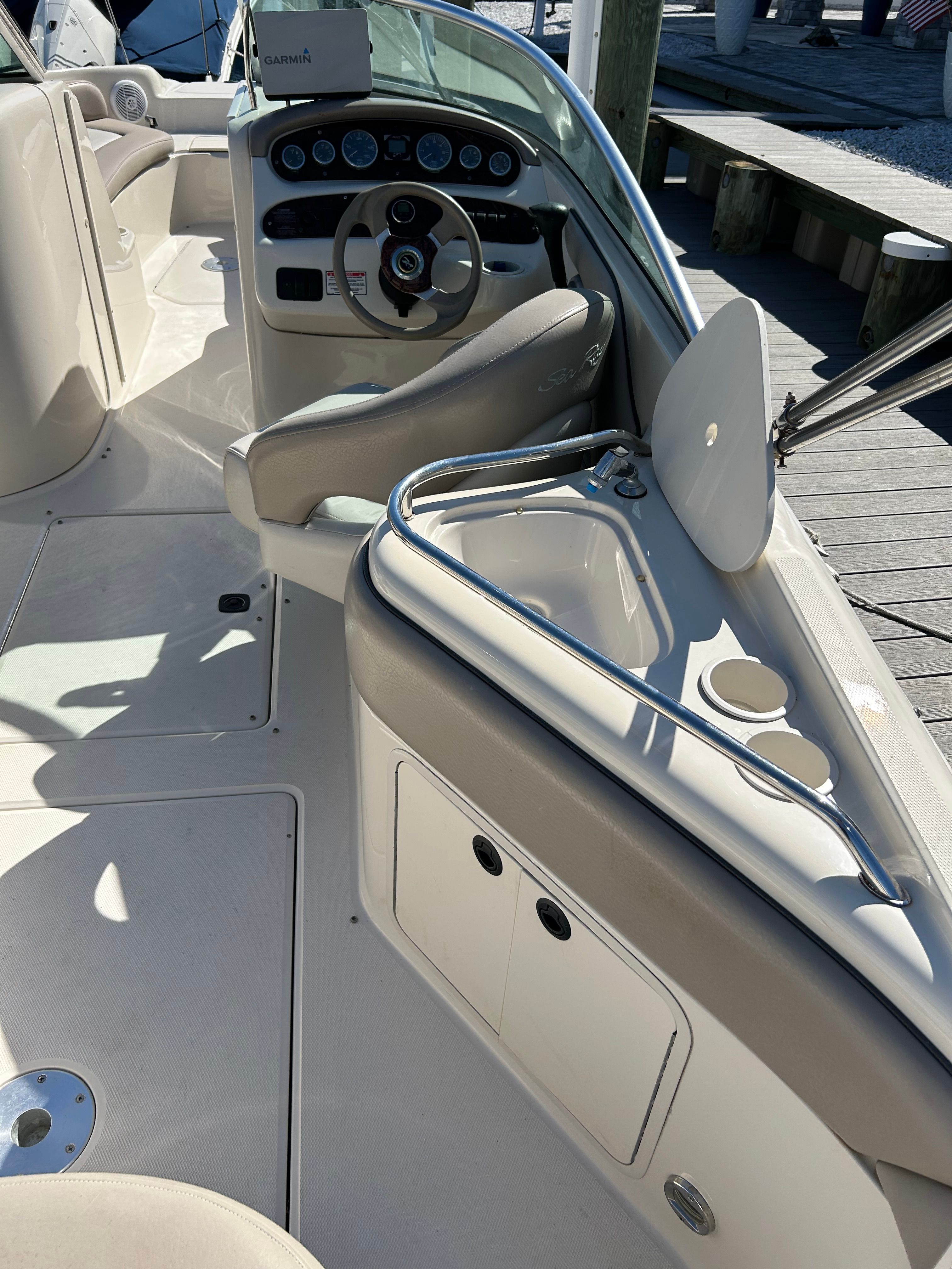 Interior of a 2003 Sea Ray 240 Sundeck boat at dock.