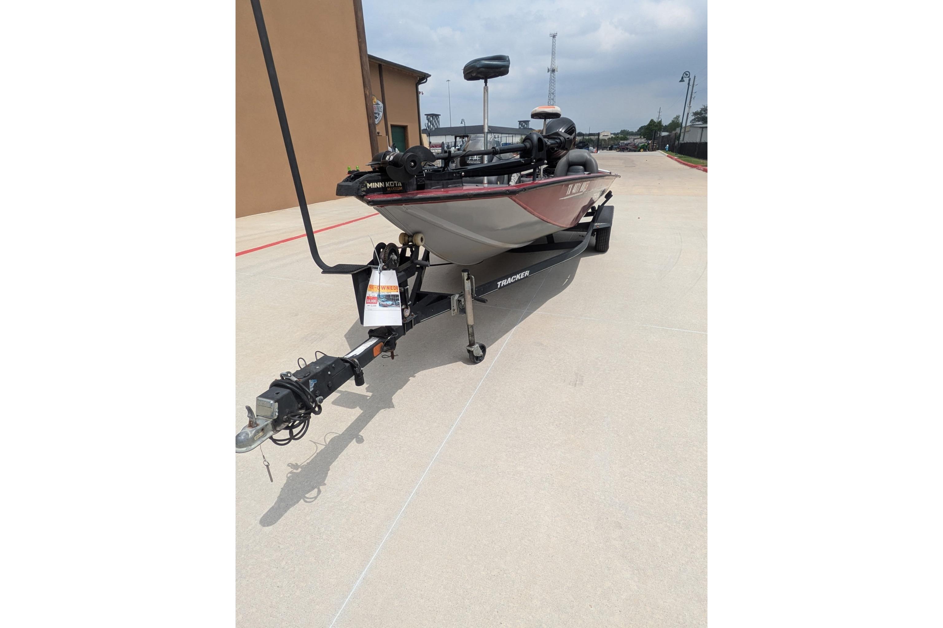 2019 Tracker Pro Team 190 boat on trailer, parked outdoors.