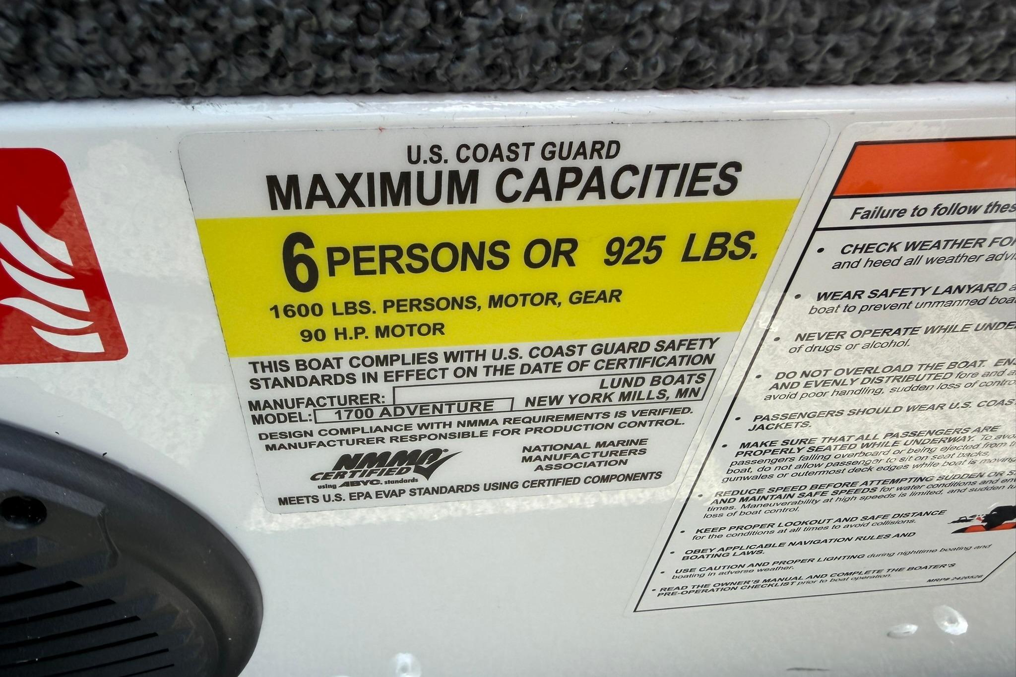 U.S. Coast Guard capacity label on 2027 Lund 1675 Adventure Sport boat.