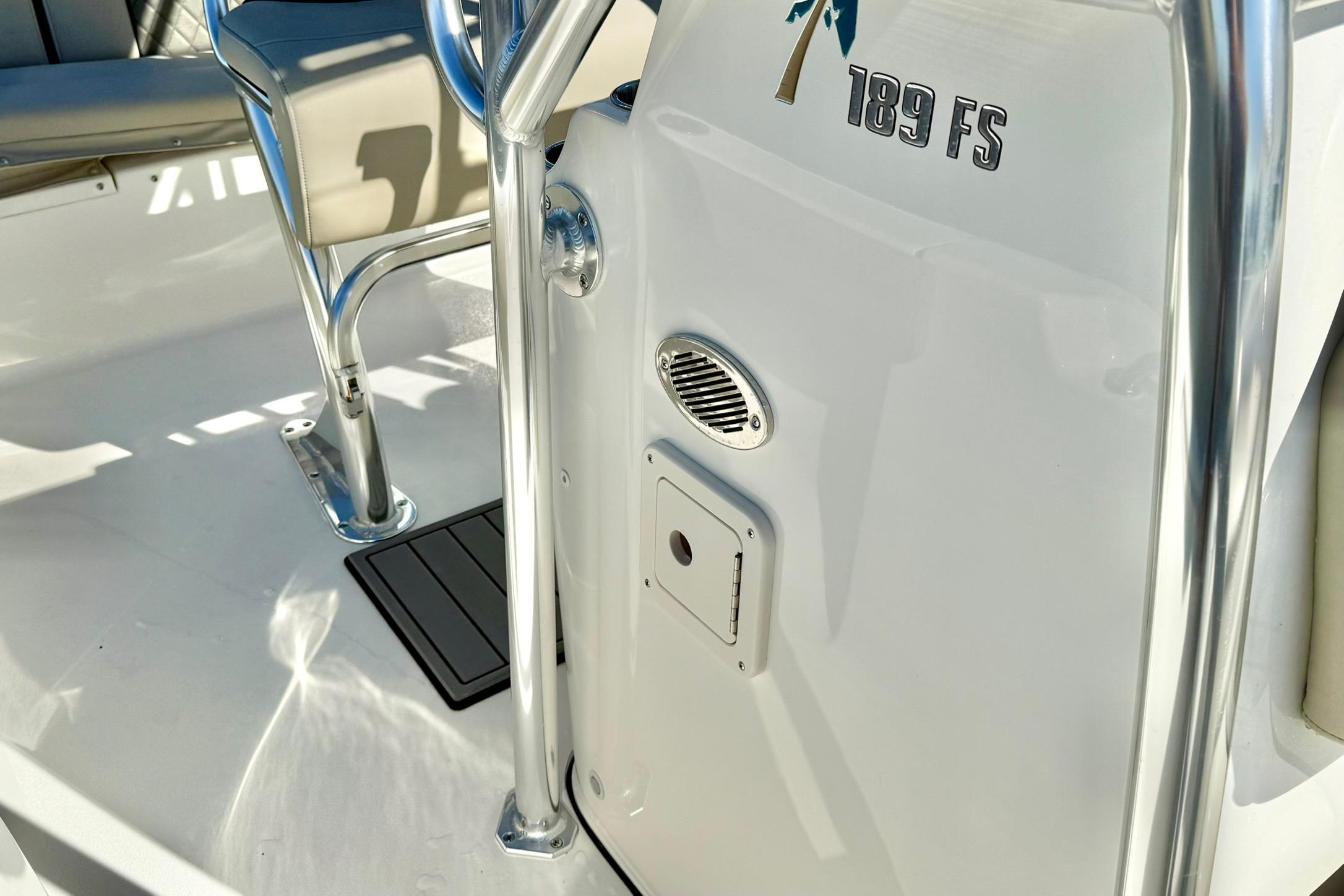2026 Key West 189 FS boat interior with seating and chrome details.