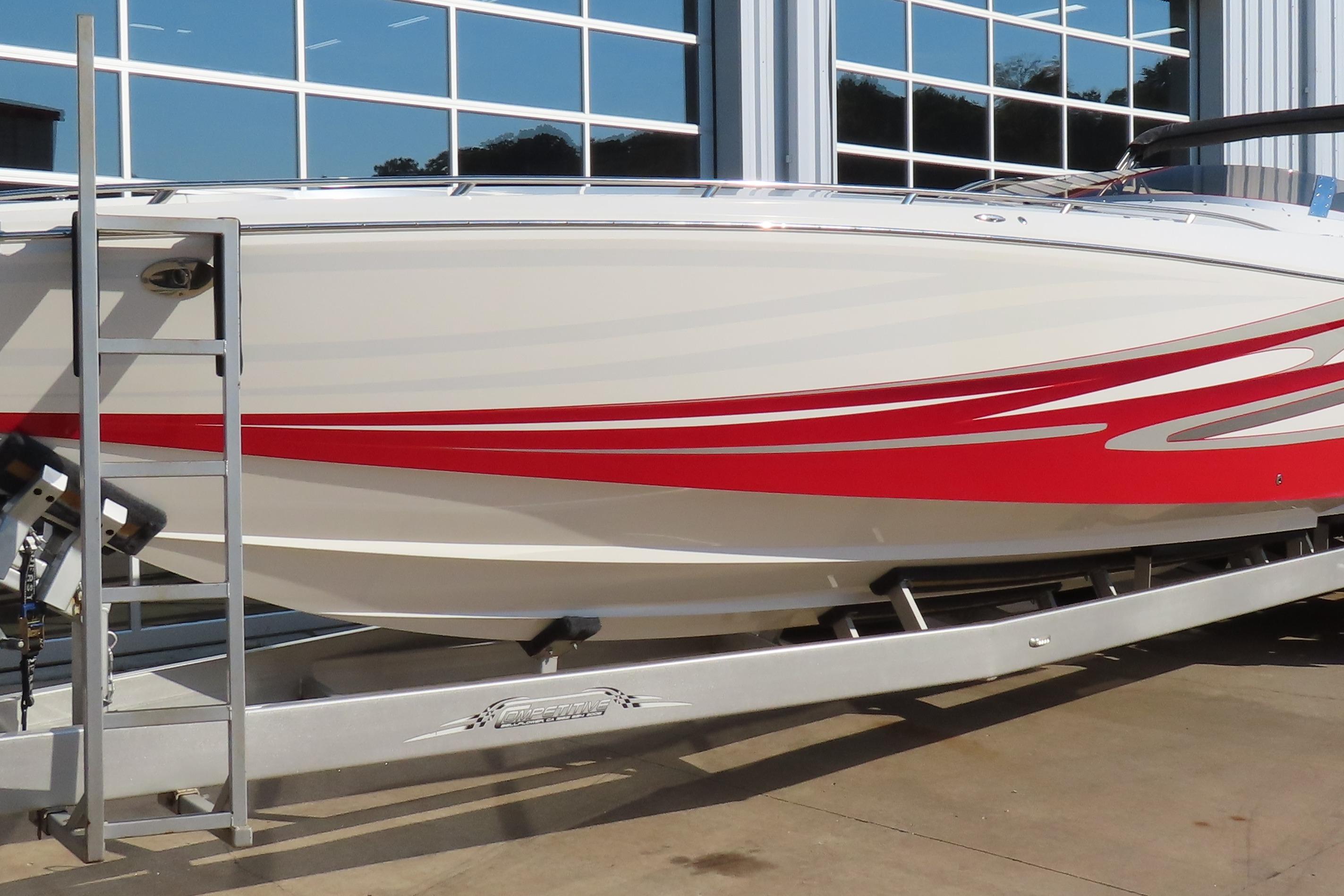 2013 Nordic 39 POKER RUN boat with red and white design on a trailer.