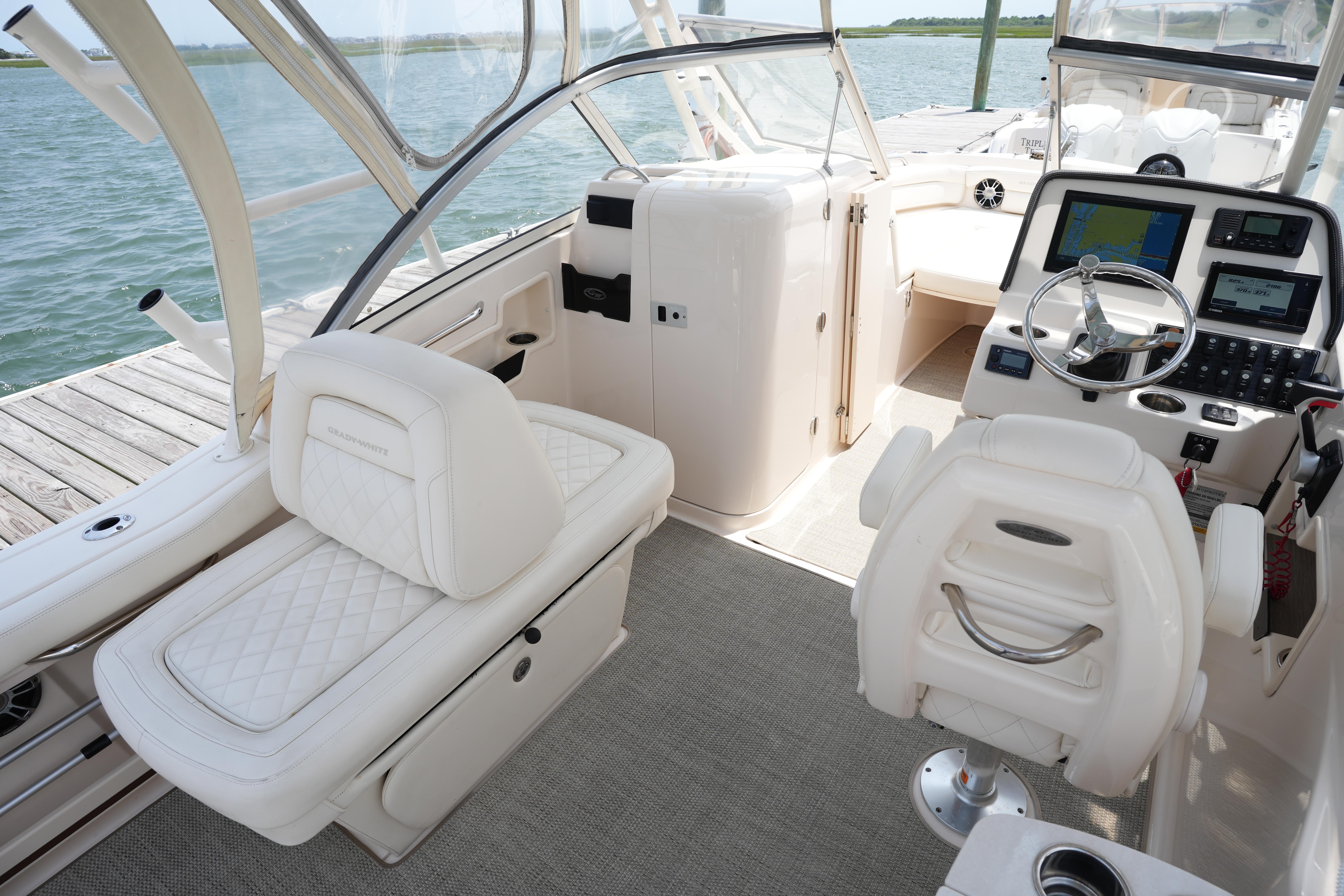 2021 Grady-White Freedom 235 boat interior with luxurious seating and modern dashboard.