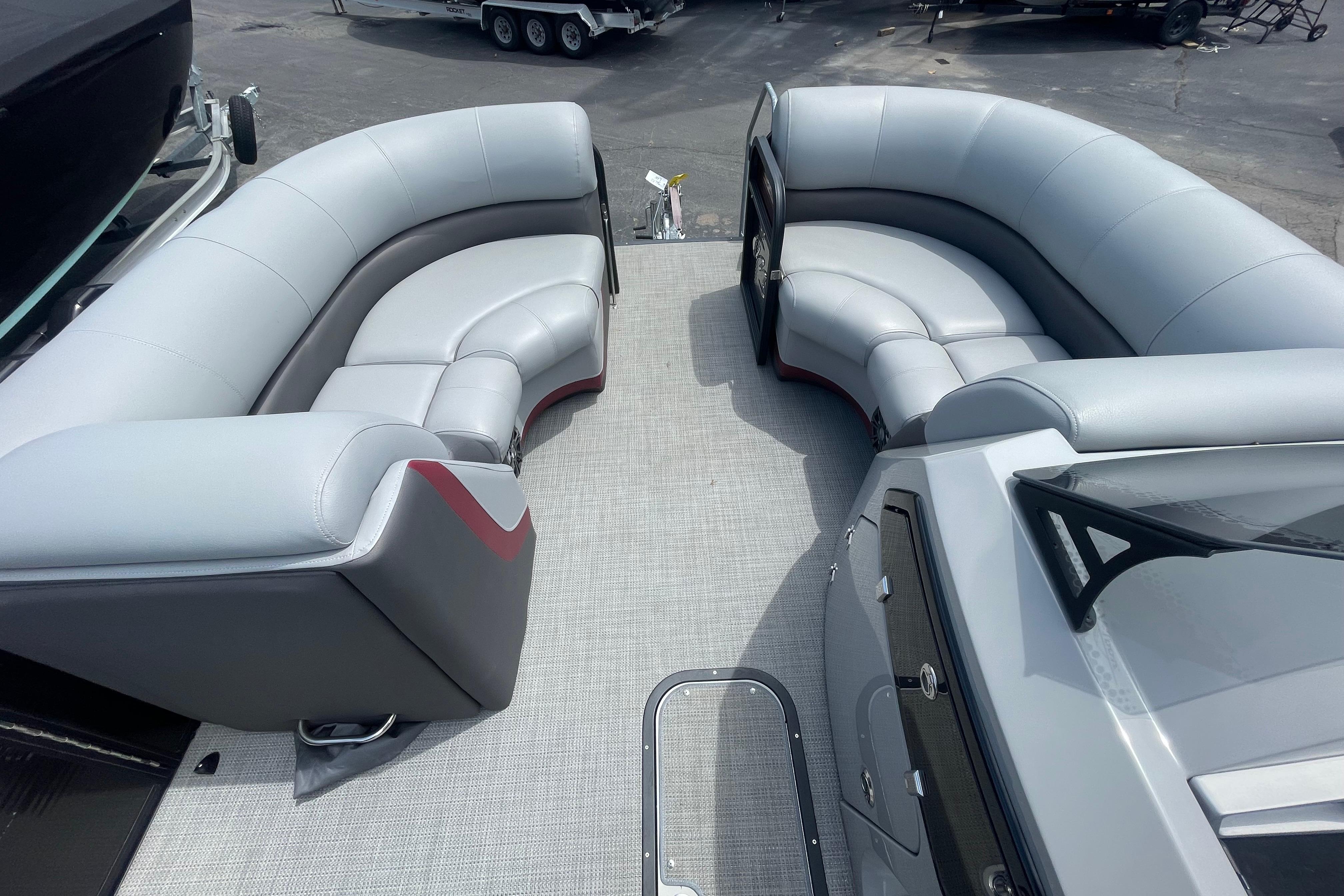 2022 Manitou 23 Oasis boat interior with luxurious gray seating and modern design.