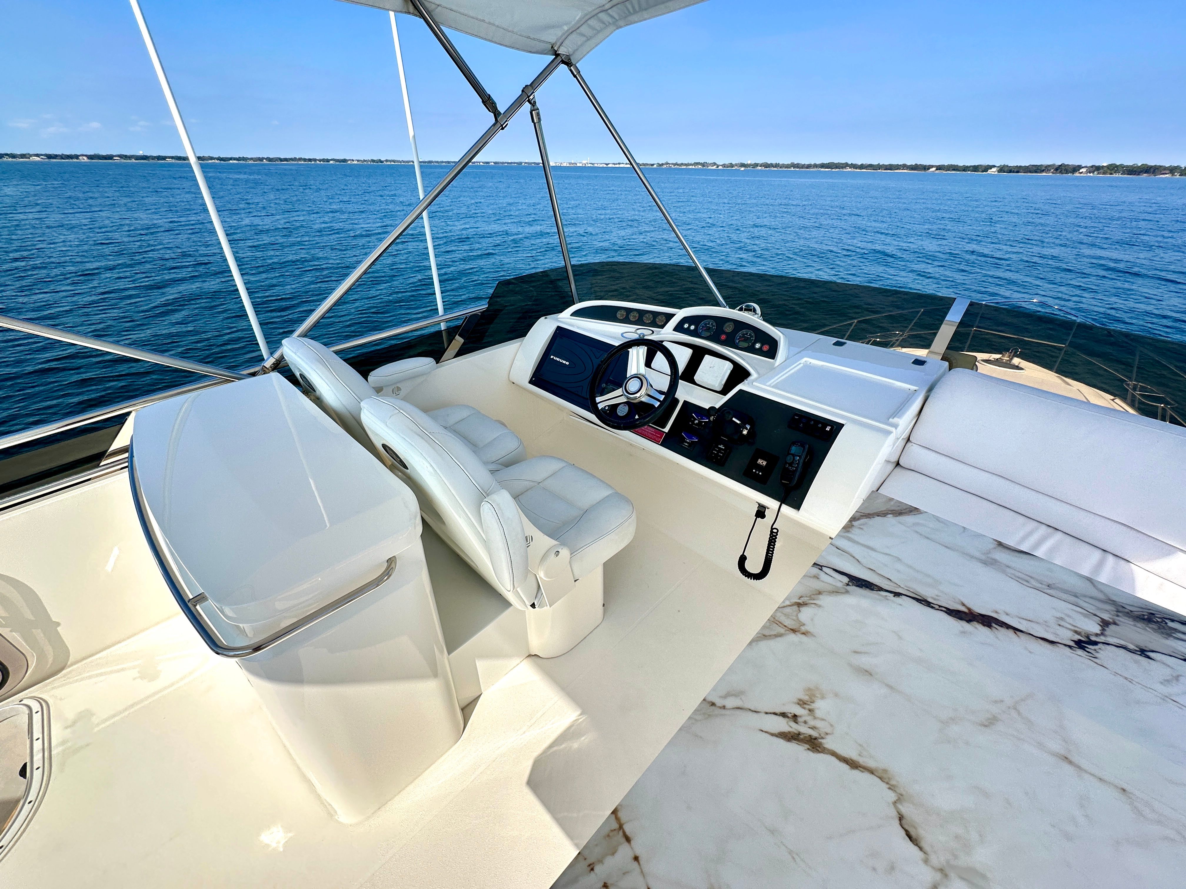 Viking Princess F54 flybridge 2009 on open sea.