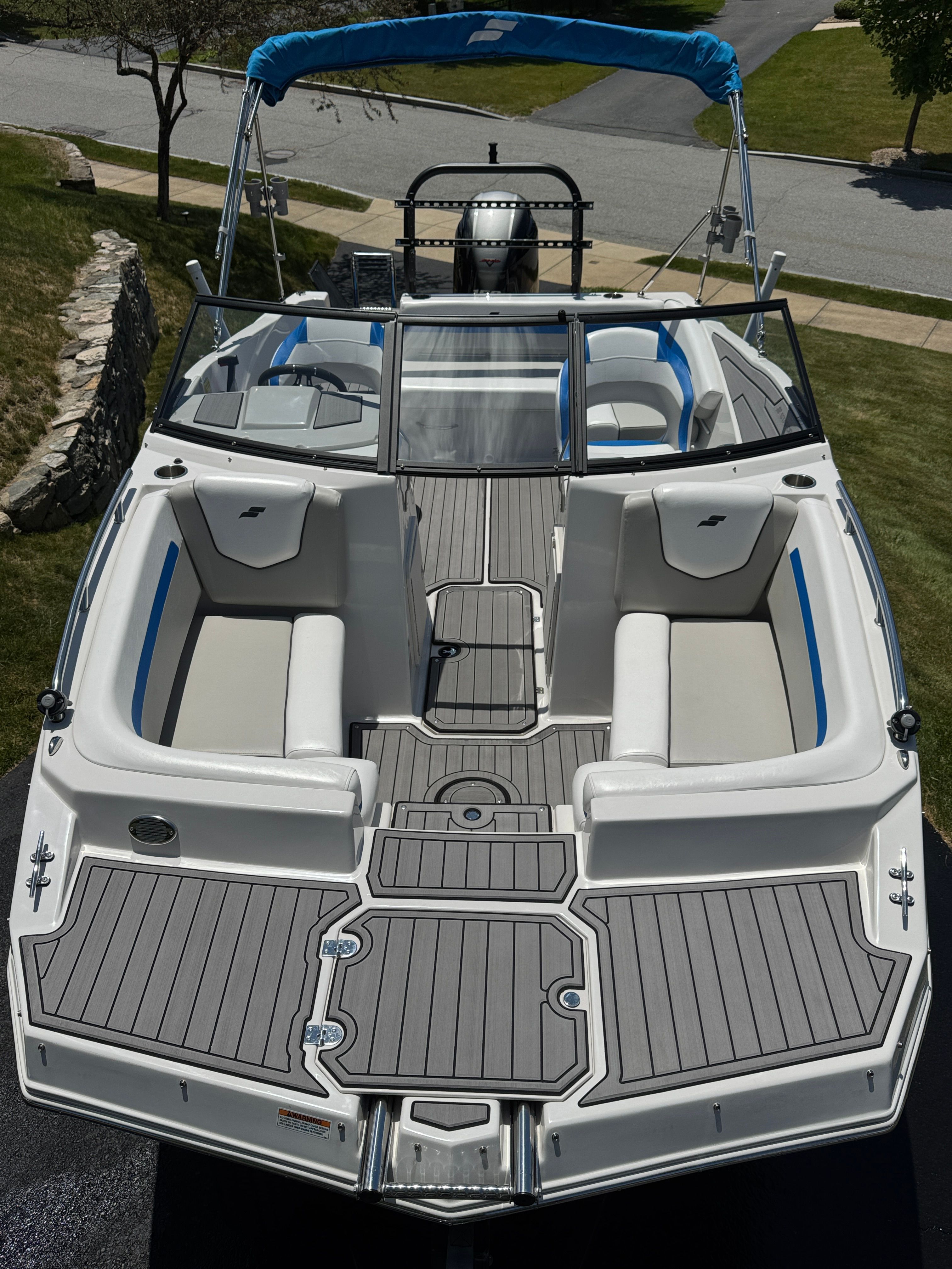 2023 Starcraft SVX 190 OB boat with gray deck and blue accents.