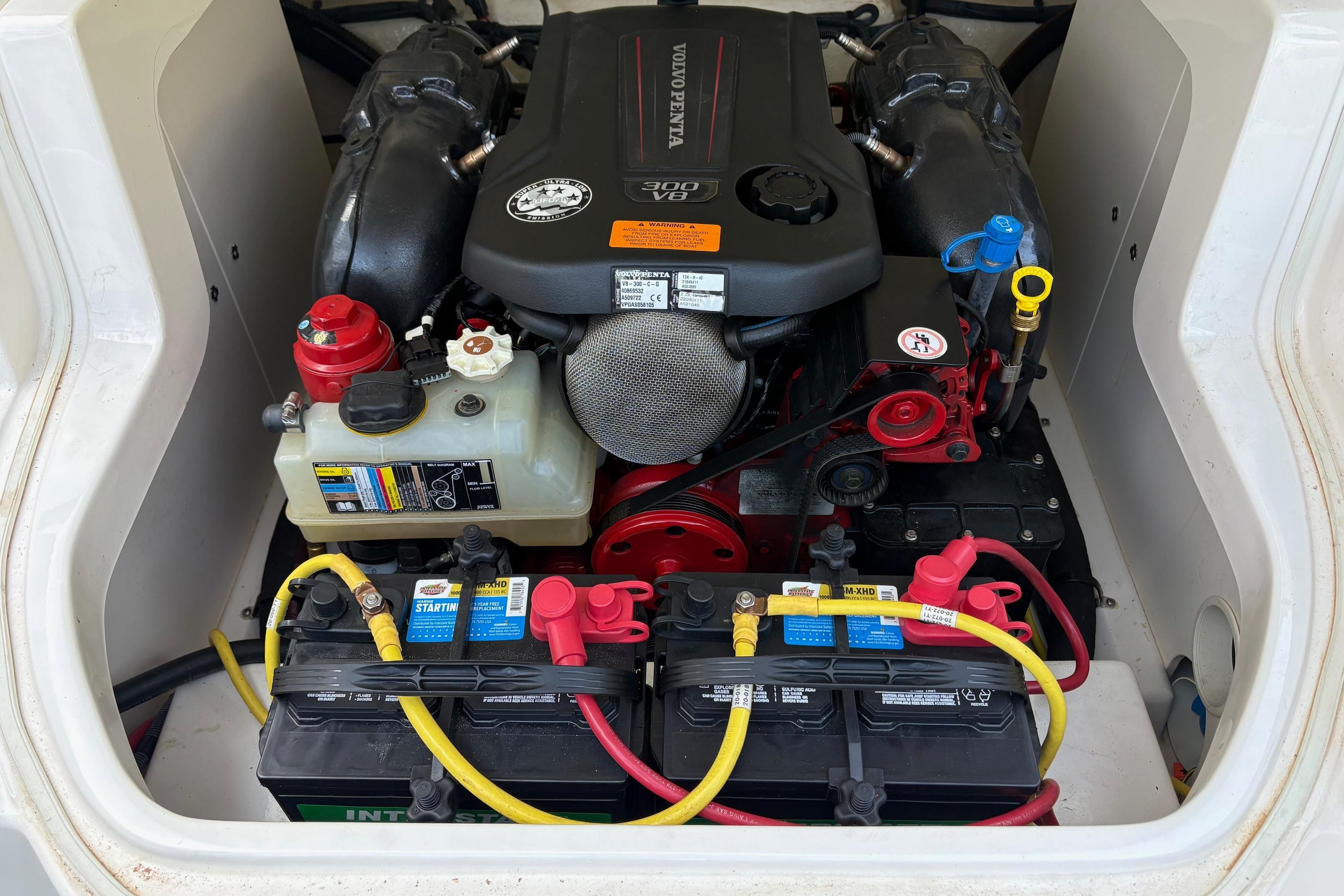 Engine compartment of a 2016 Chaparral 246 SSi boat, featuring a Volvo Penta engine.