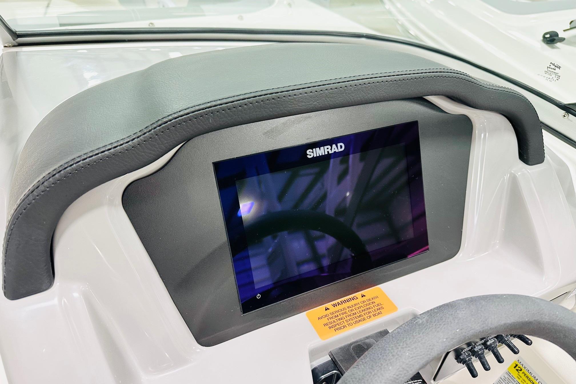 Dashboard of 2025 Chaparral 21 SSi OB with Simrad display.