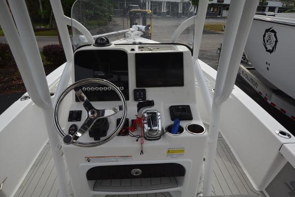2021 Sea Pro 228 Bay boat console with steering wheel and navigation controls.