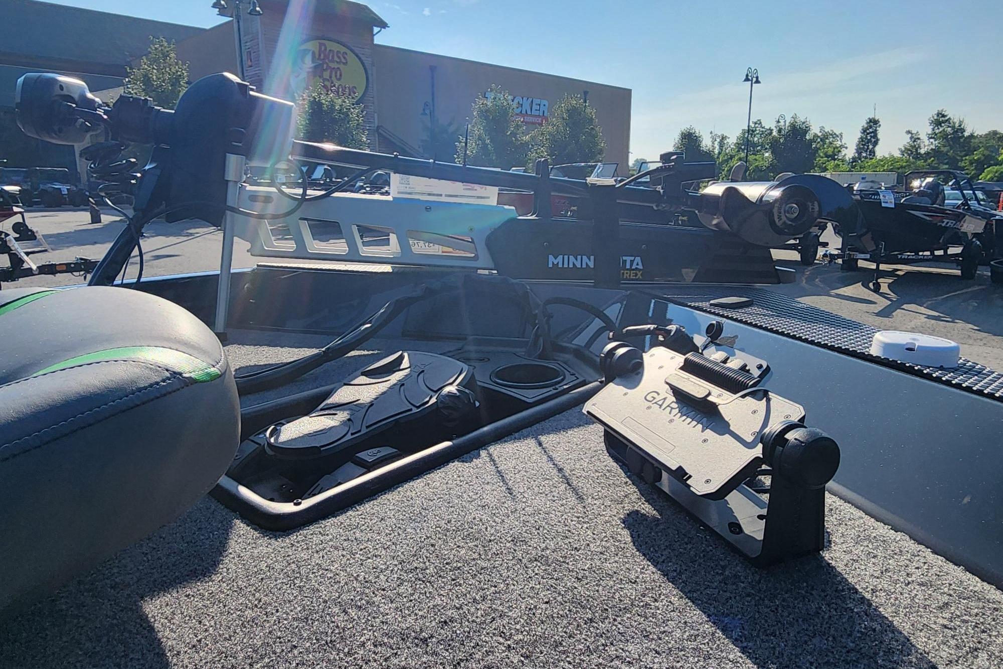 2026 Ranger RT178 boat interior with Garmin and Minn Kota equipment in a parking lot.