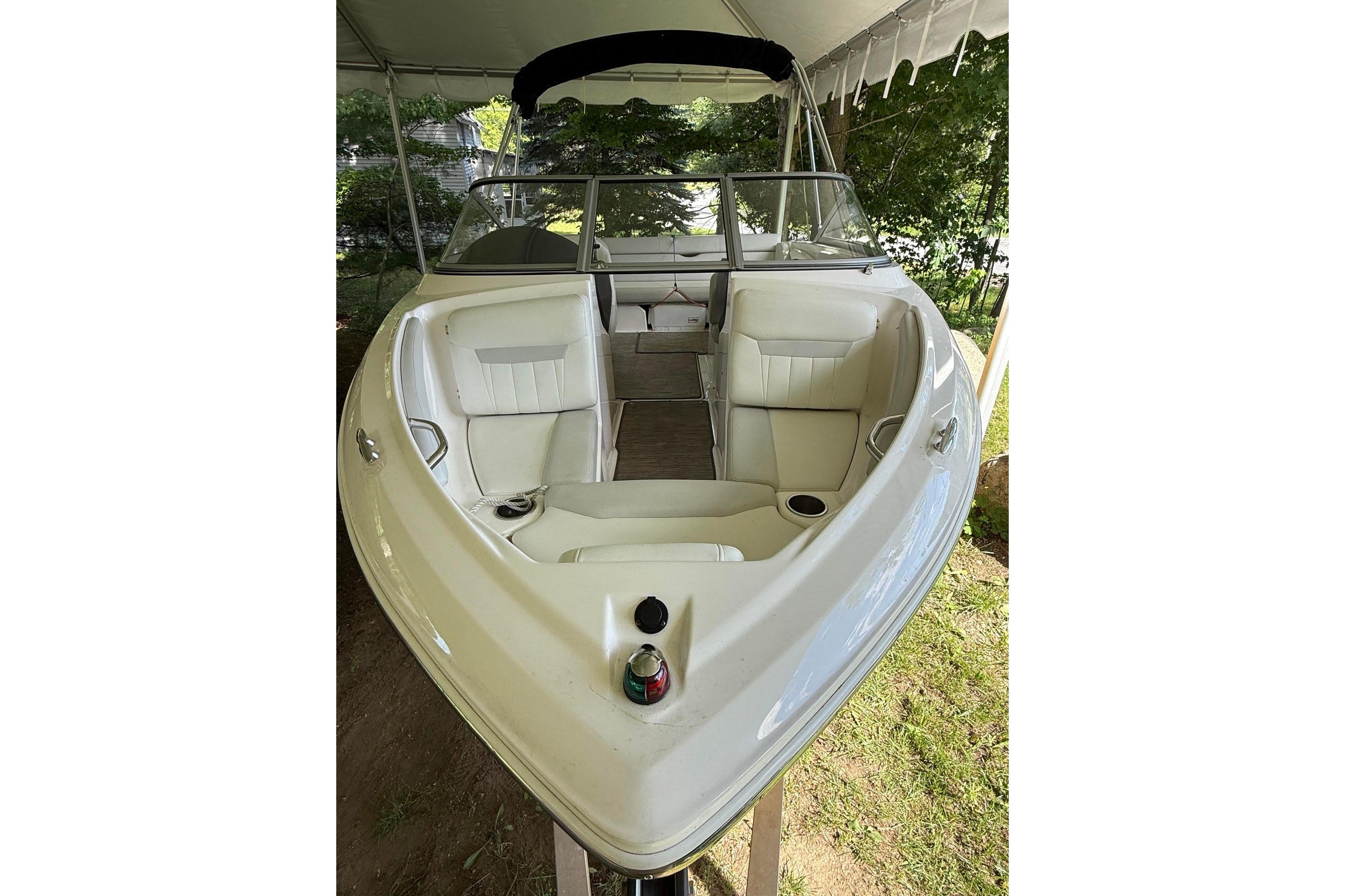 2016 Regal 1900 ES Bowrider interior with white seating under canopy.