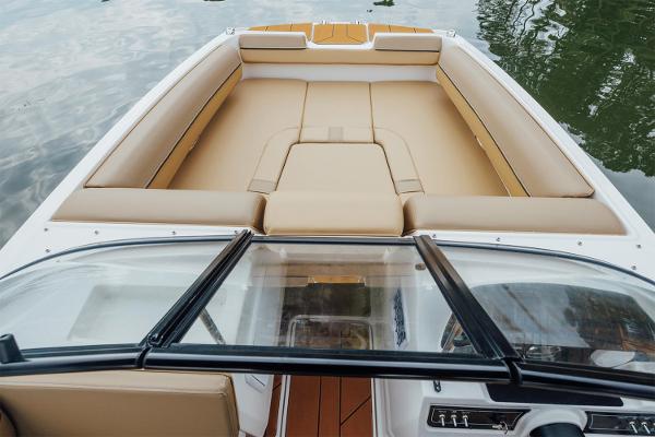 Manufacturer Provided Image: 2025 Bayliner D20 boat interior with tan seating and sleek windshield design.