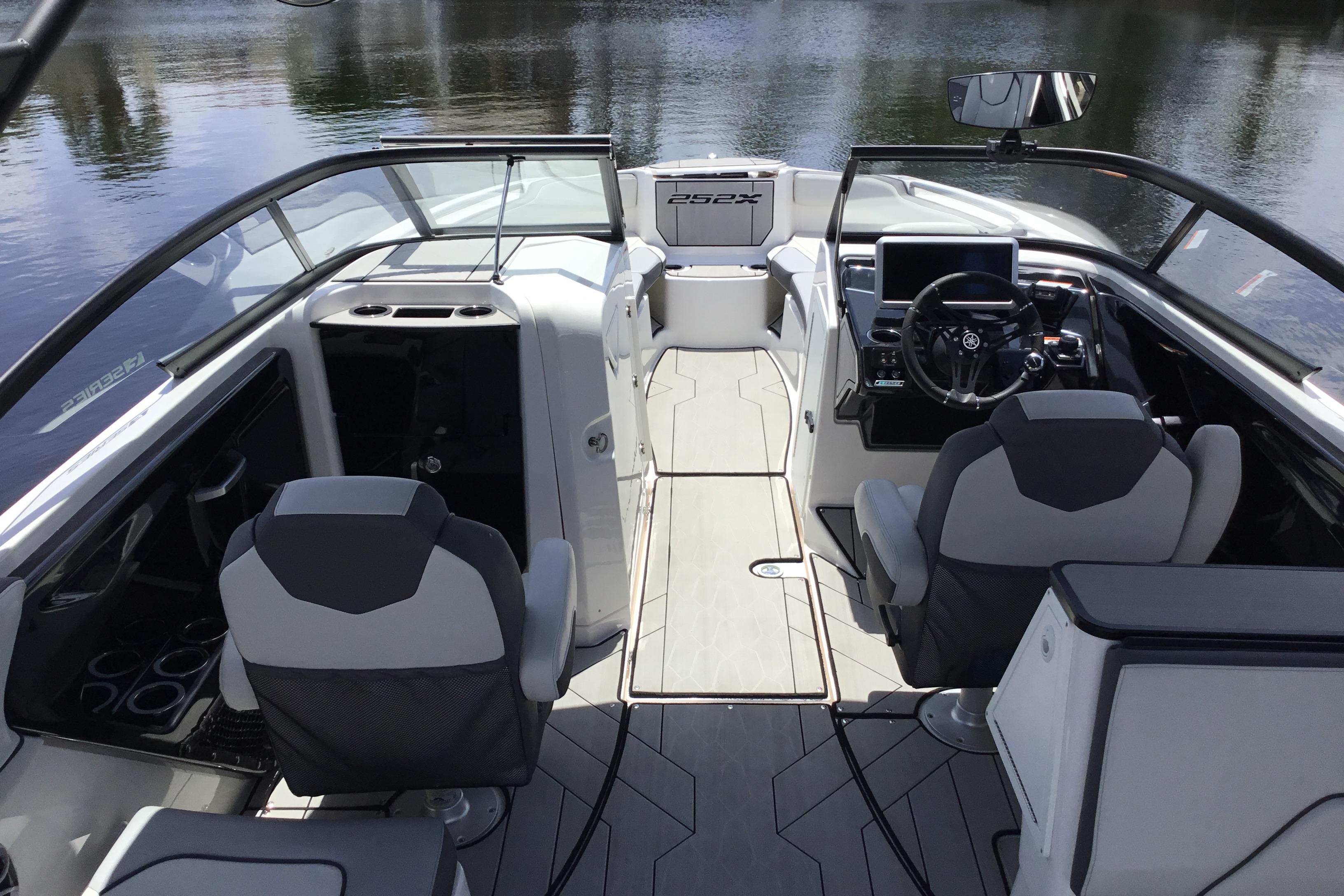 2023 Yamaha Boats 252XE interior with modern seating and sleek dashboard design.