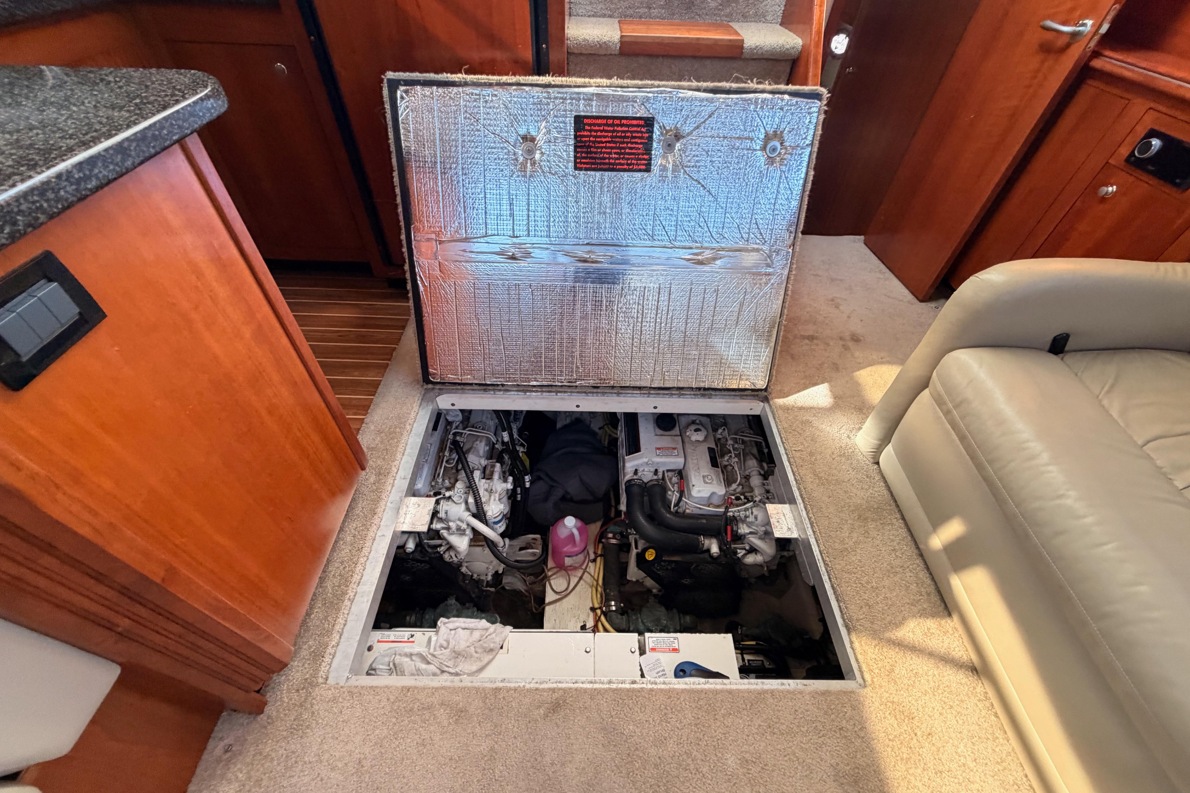 Engine compartment of 2005 Cruisers Yachts 405 Express Motoryacht, showcasing interior details.