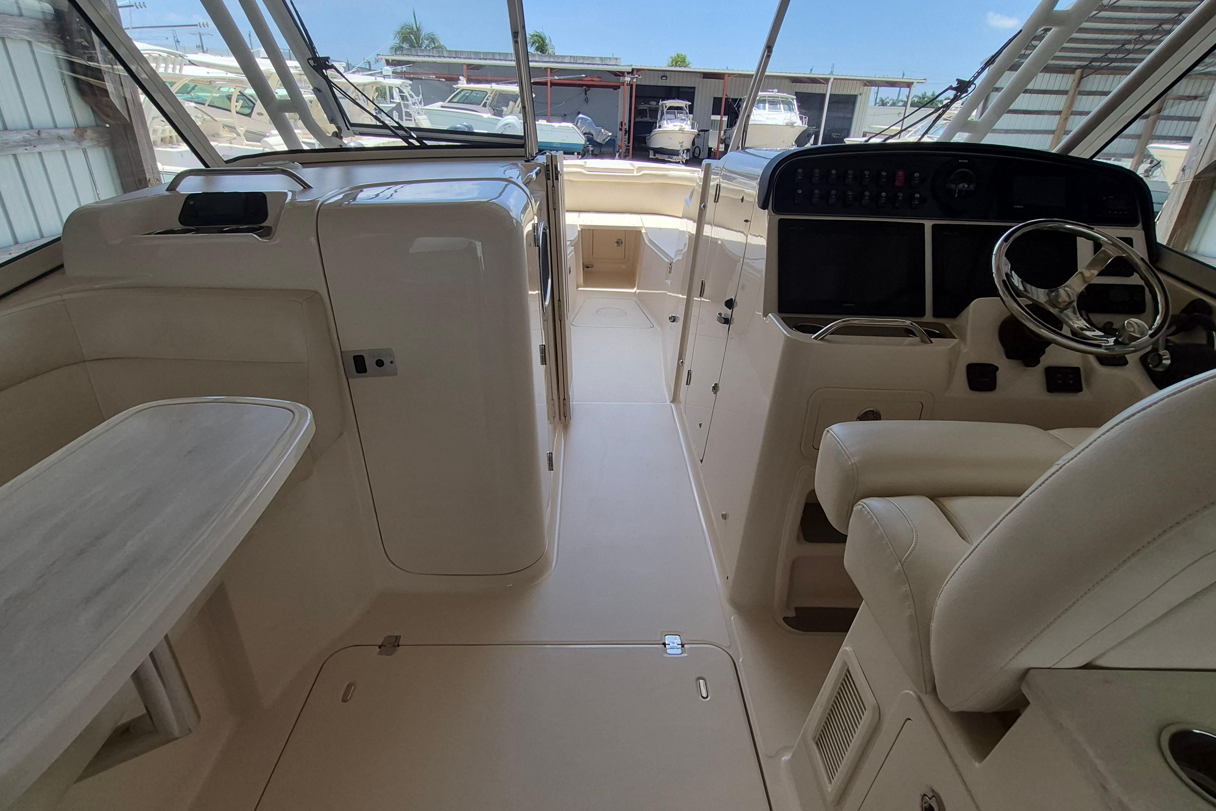 2019 Grady-White Freedom 335 boat interior with helm, seating, and table.