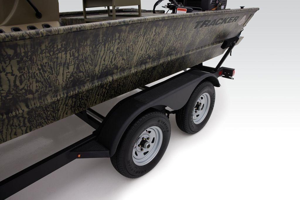 2026 Tracker GRIZZLY® 2072 CC Sportsman boat on trailer, featuring camouflage design.
