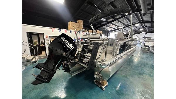 2025 Tahoe Pontoon Cascade Cruise Rear Bench with Suzuki engine in showroom.