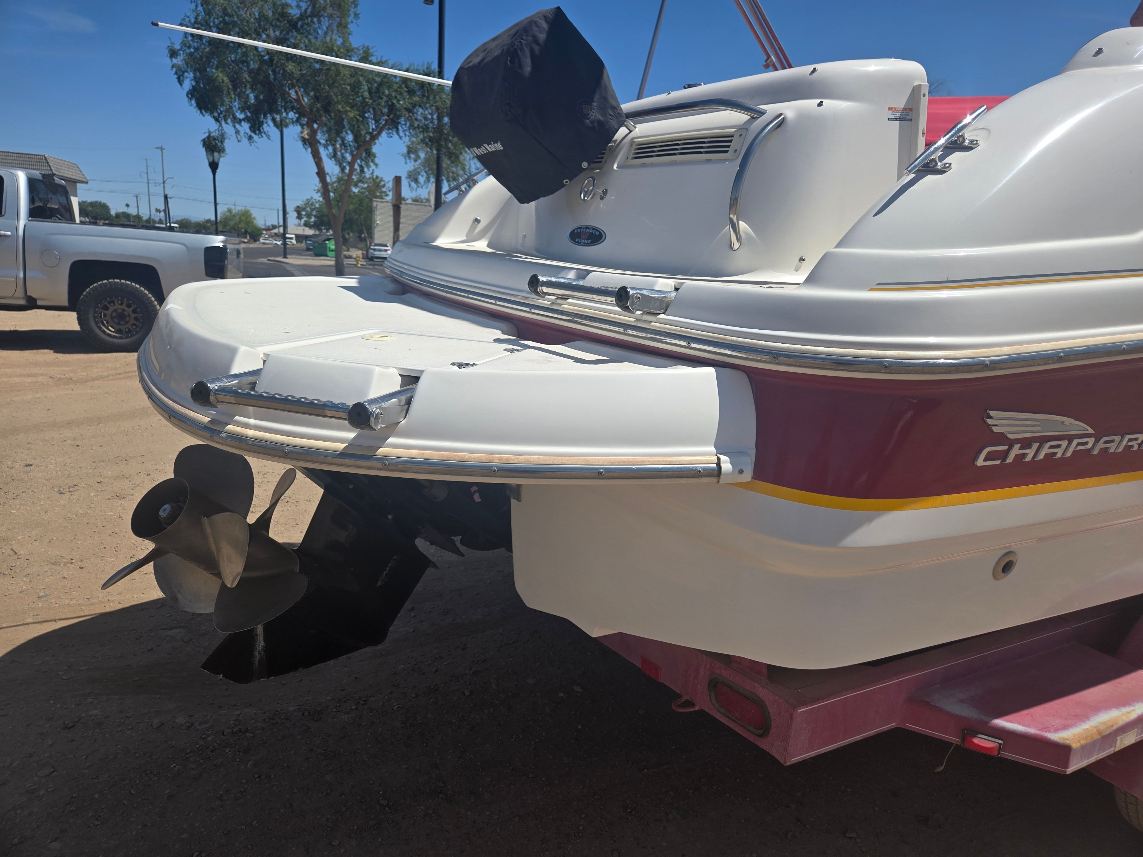 Rear view of a 2001 Chaparral Sunesta 233 boat on a trailer.