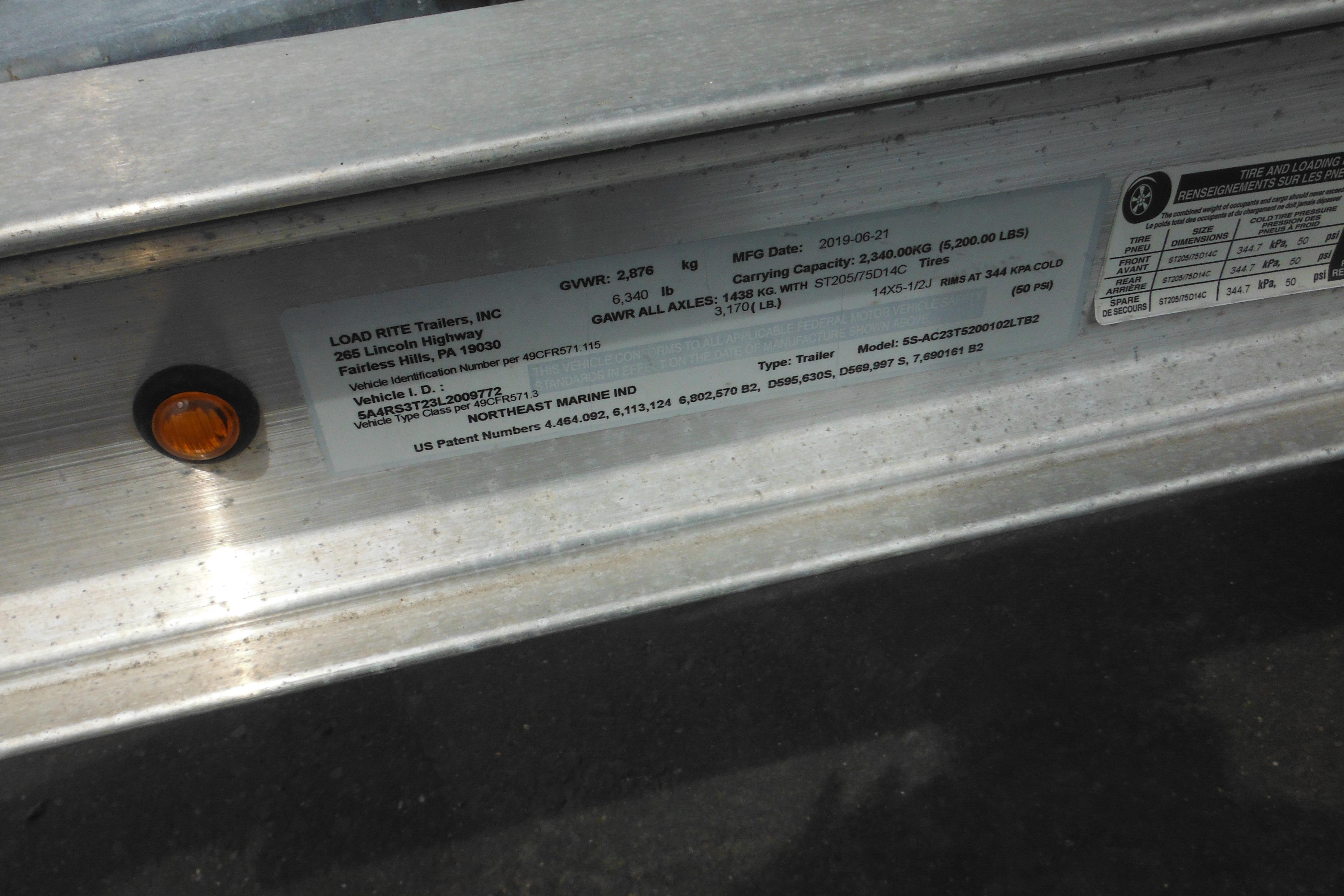 Label on Load Rite trailer with specifications and manufacturing details.