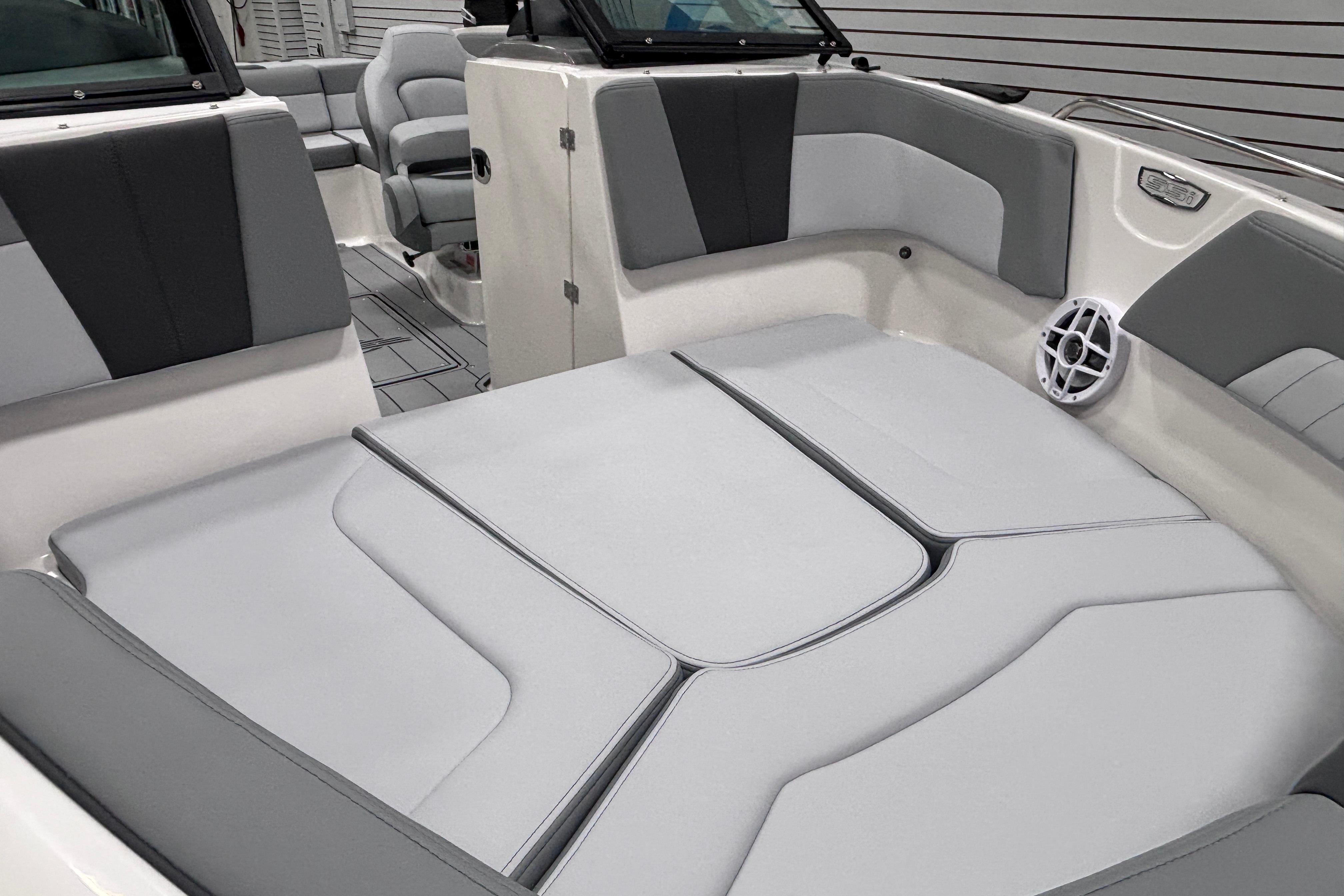2026 Chaparral 23 SSi boat interior with gray seating and modern design.