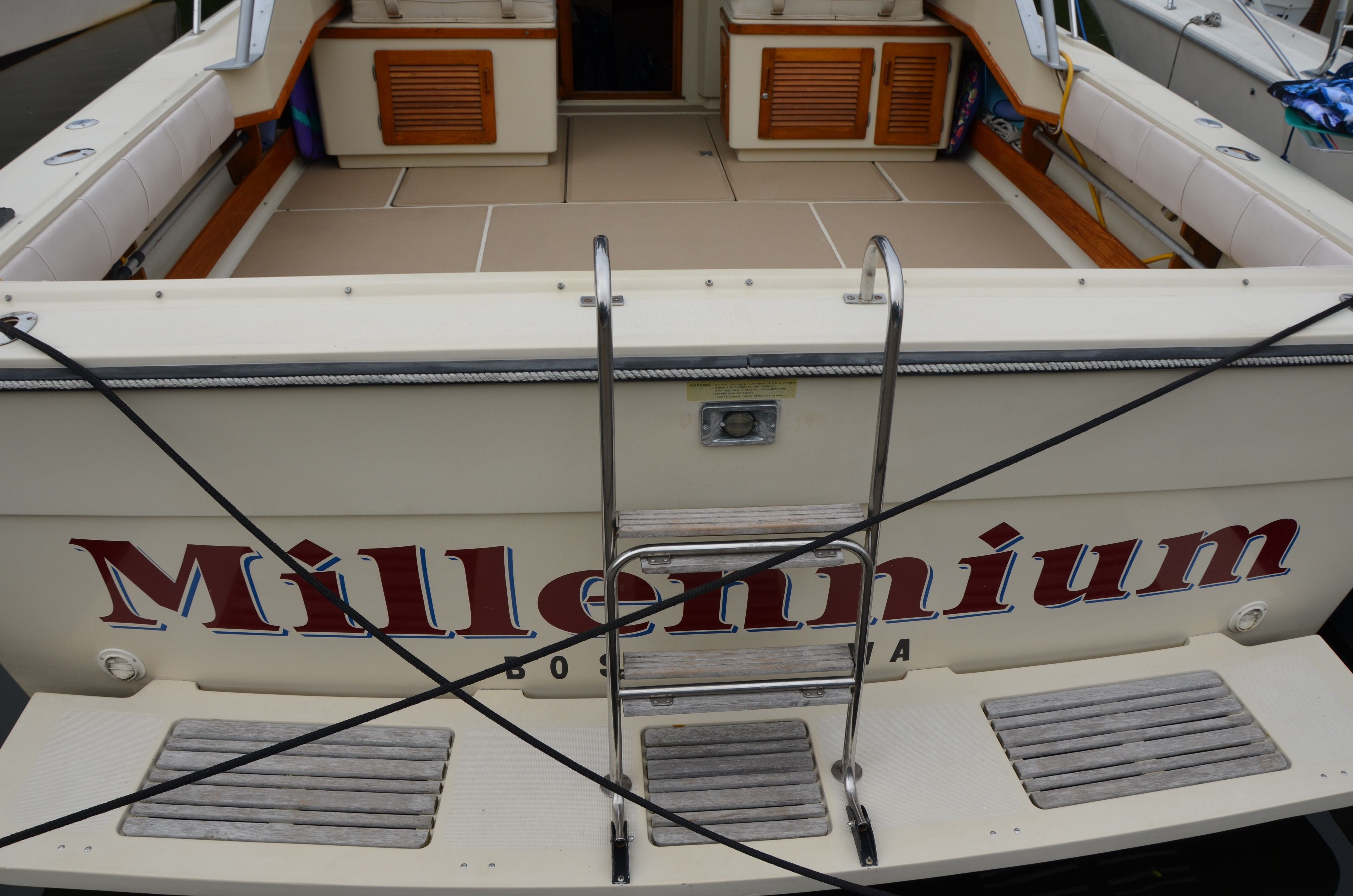 Rear view of a 1985 Tiara Yachts 3100 Open docked.