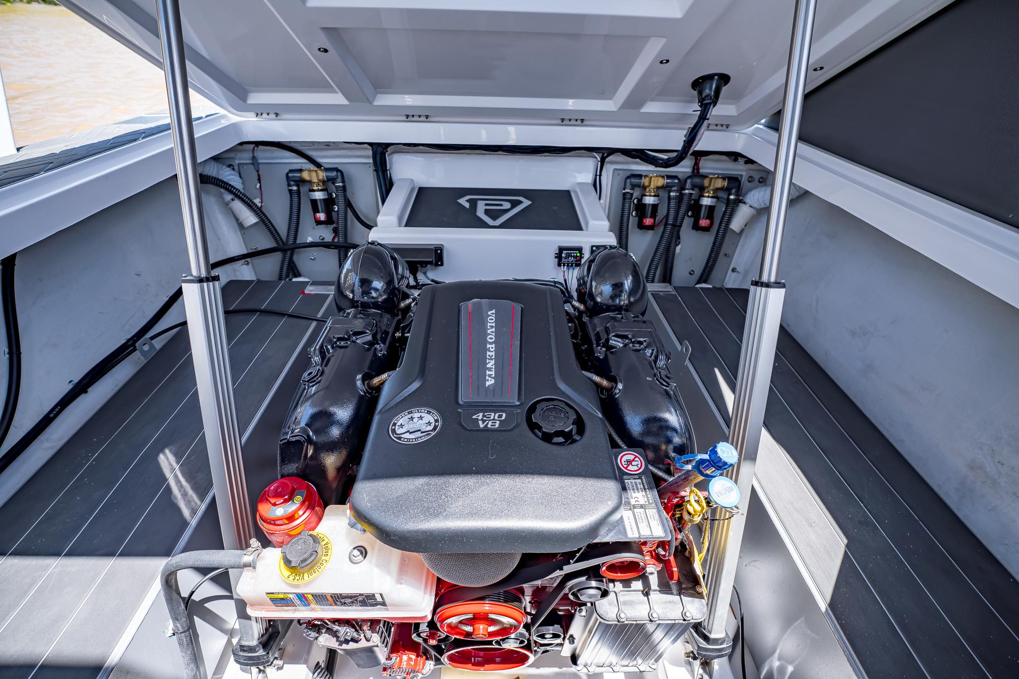 Engine compartment of 2025 Paradigm Damascus 266 Surf boat with Volvo Penta 430 V8 engine.