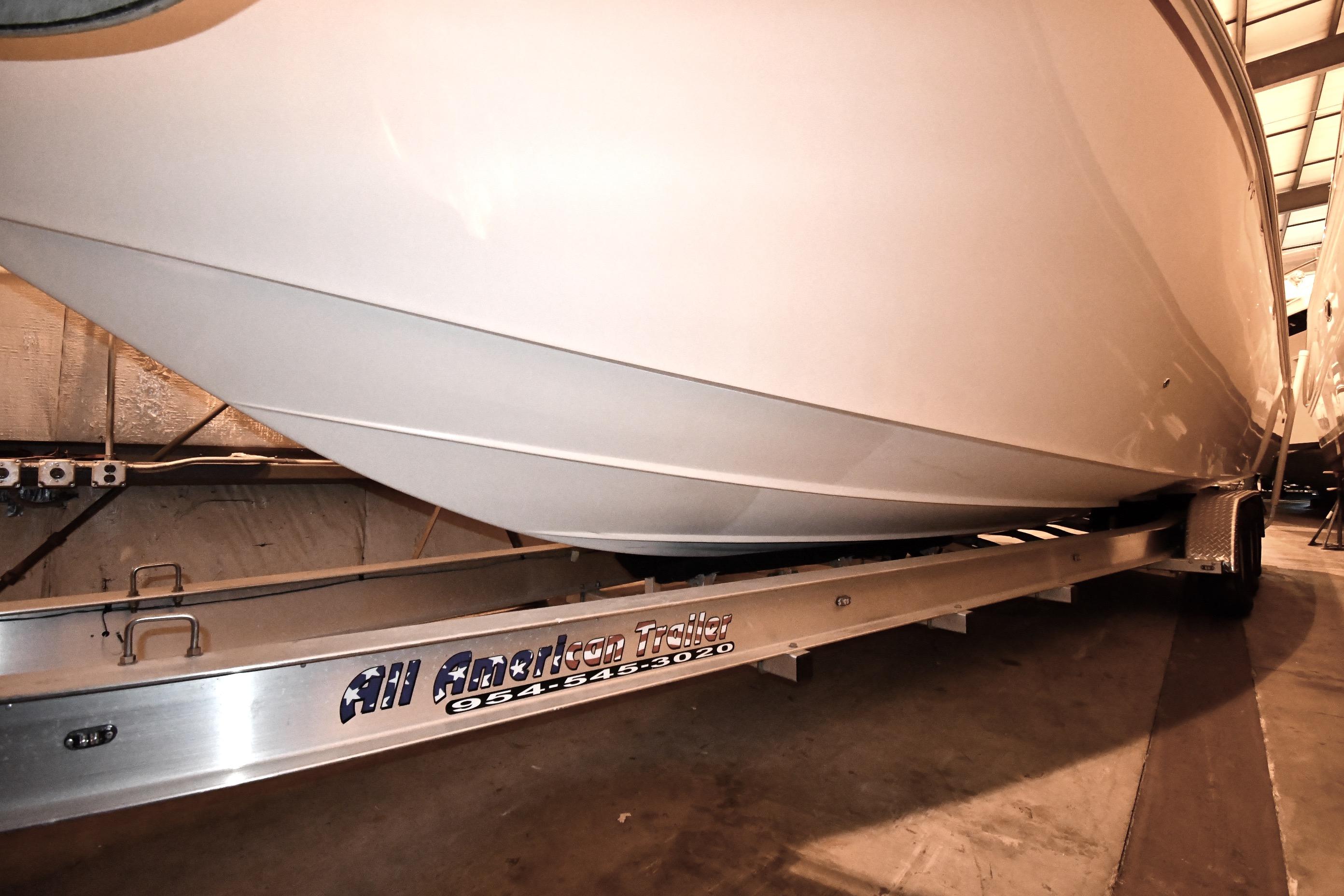 2001 Fountain 38 Center Console boat on trailer in indoor storage.