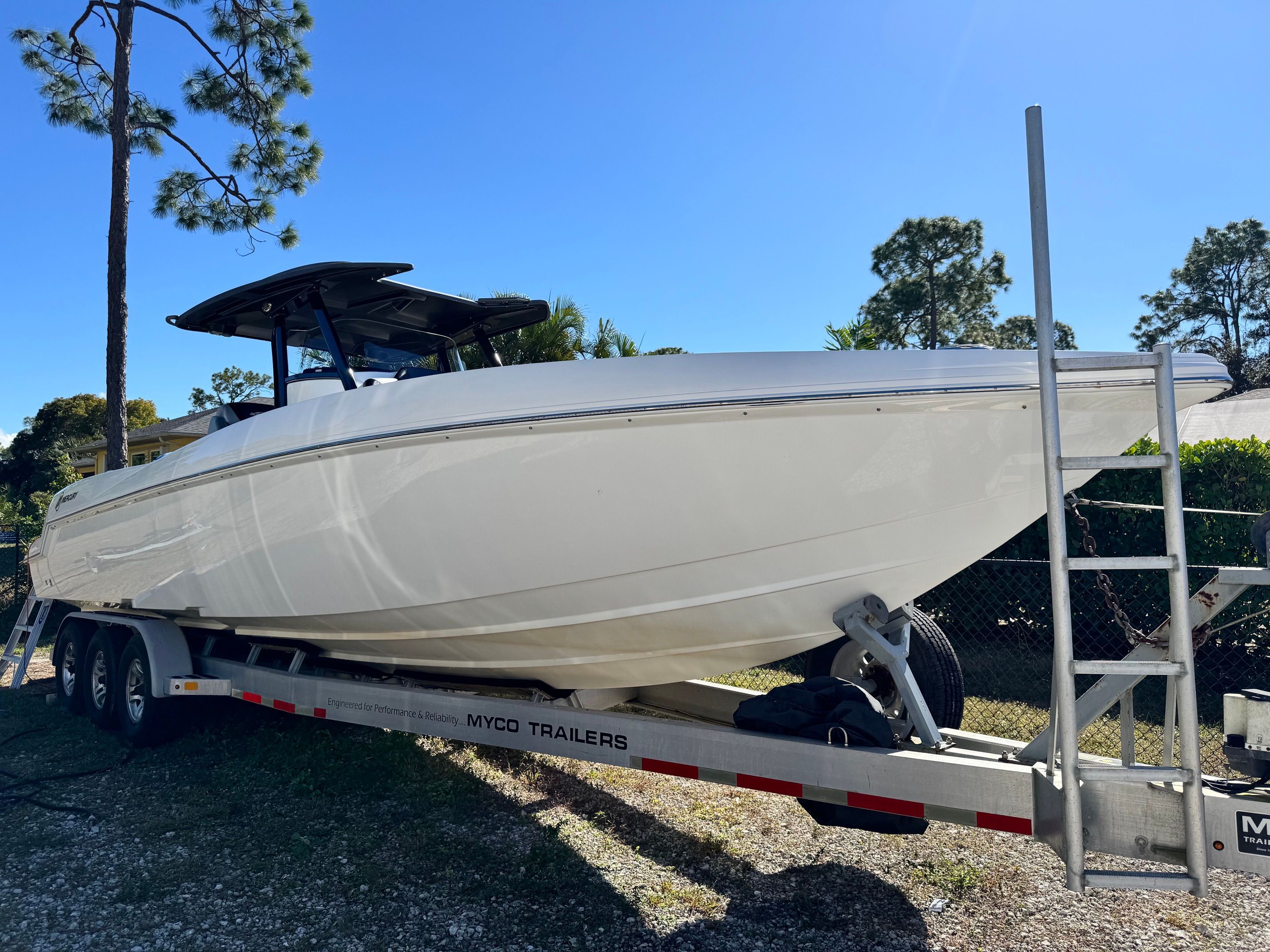 2017 Sunsation 32 CCX boat on trailer outdoors.