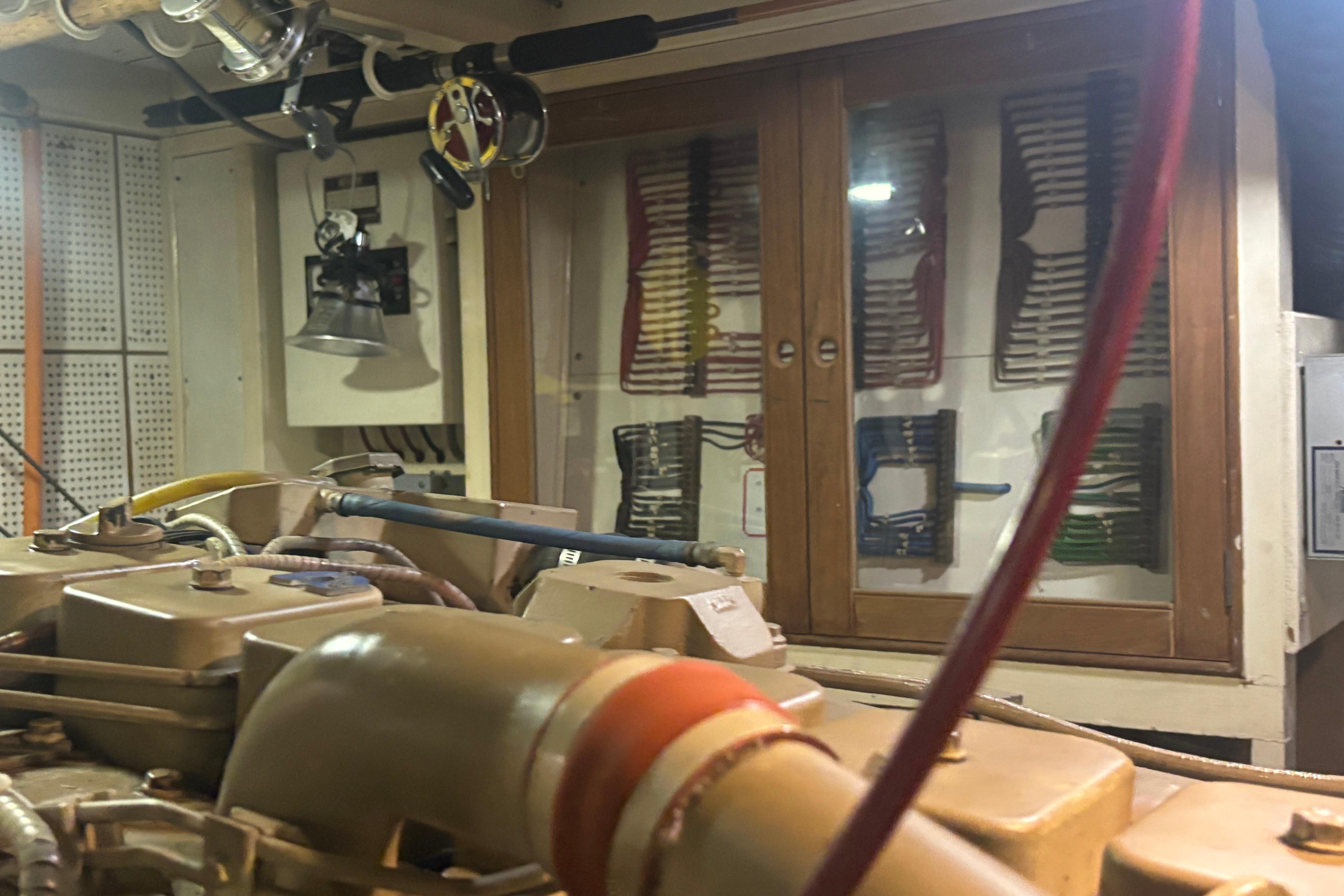Engine room of 1989 Grand Banks 46 Classic yacht with organized wiring and equipment.