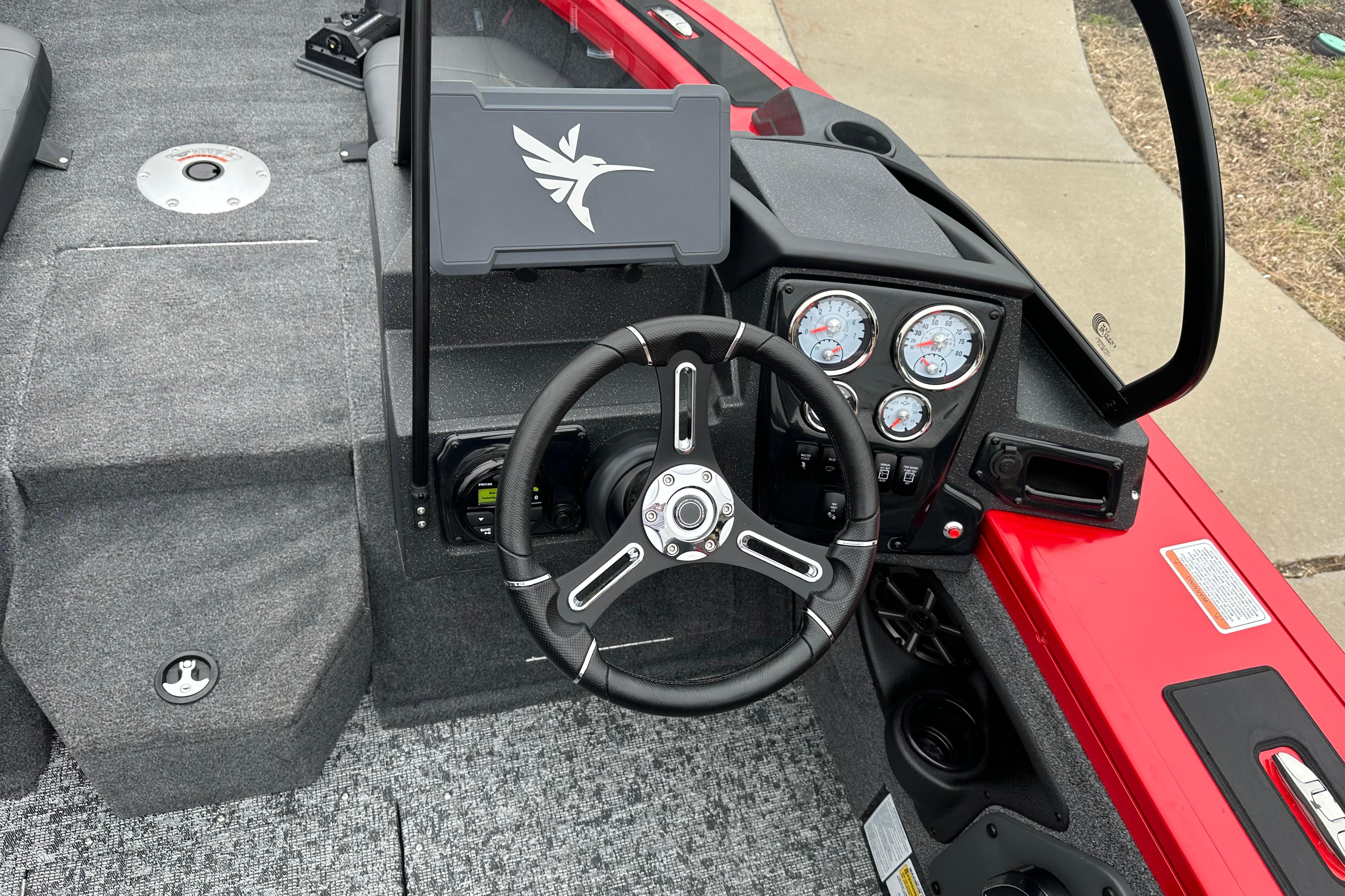 2026 Tracker Targa V-19 Combo boat dashboard with steering wheel and instrument panel.