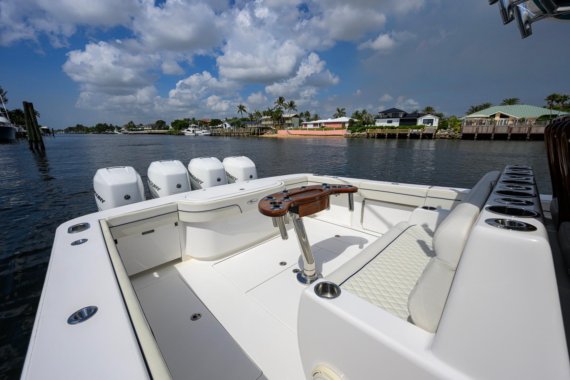 2020 Valhalla Boatworks V-41, spacious deck, luxurious seating, and multiple outboard engines.