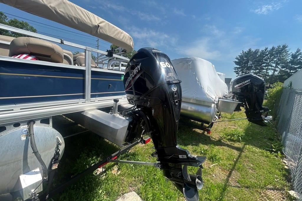 2023 Sun Tracker Bass Buggy 18 DLX pontoon boat with Mercury outboard motor.