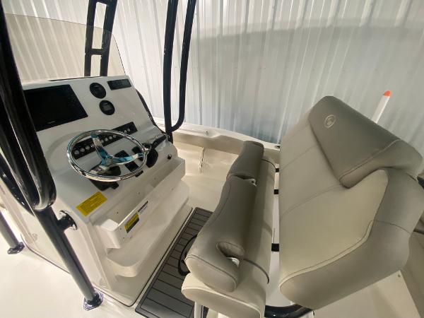 2024 Key West 219 FS boat console and seating area.
