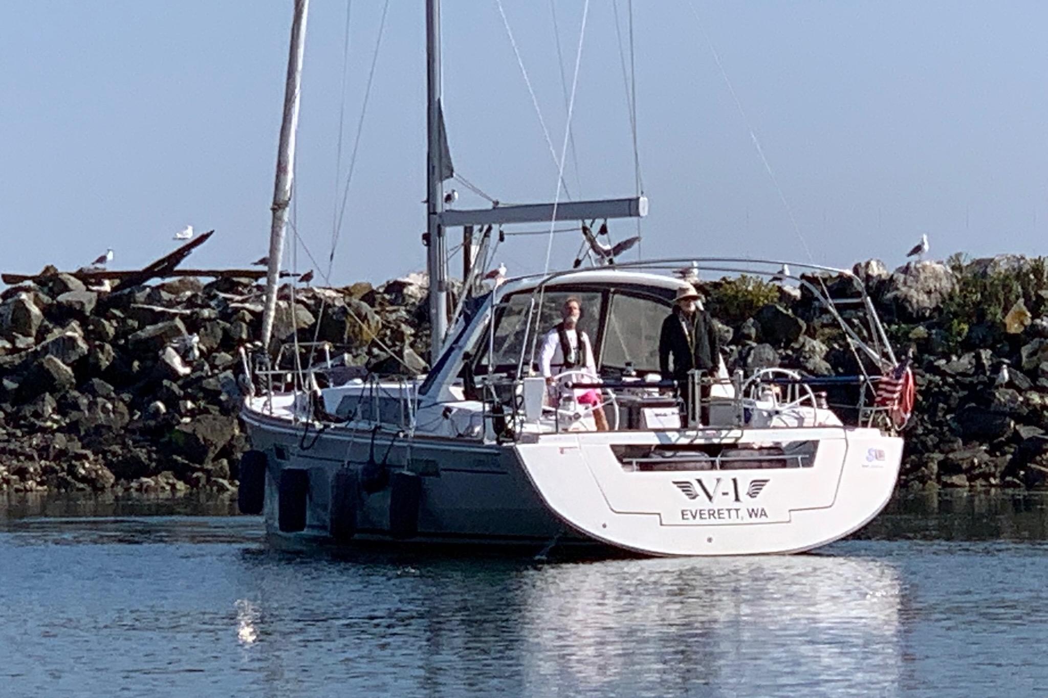 2018 Beneteau Oceanis 45 sailboat in calm waters near rocky shore, Everett, WA.